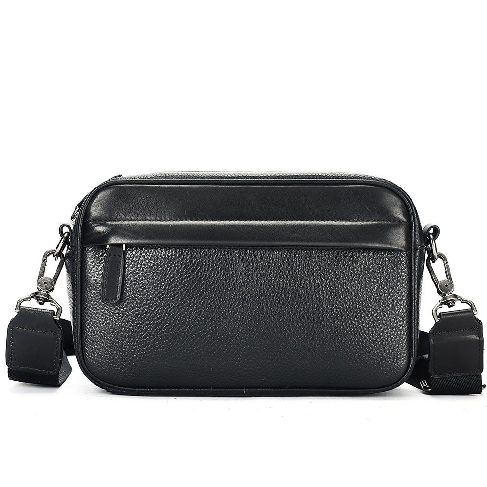 Barcon Getta Inc black full grain Ethiopian leather crossbody bag with front and back zipper pockets.