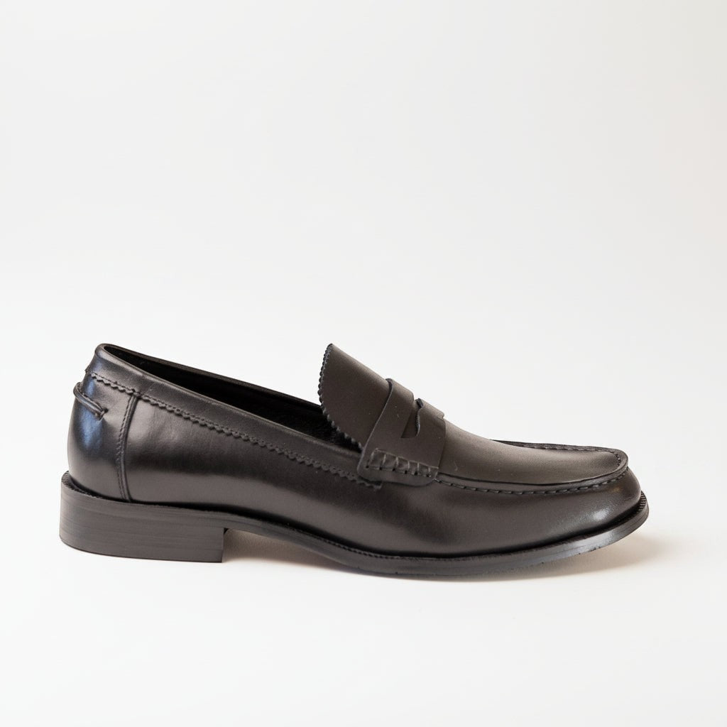 Barcon Getta Inc ABUJA black leather penny loafers with traditional strap detail and sleek silhouette.