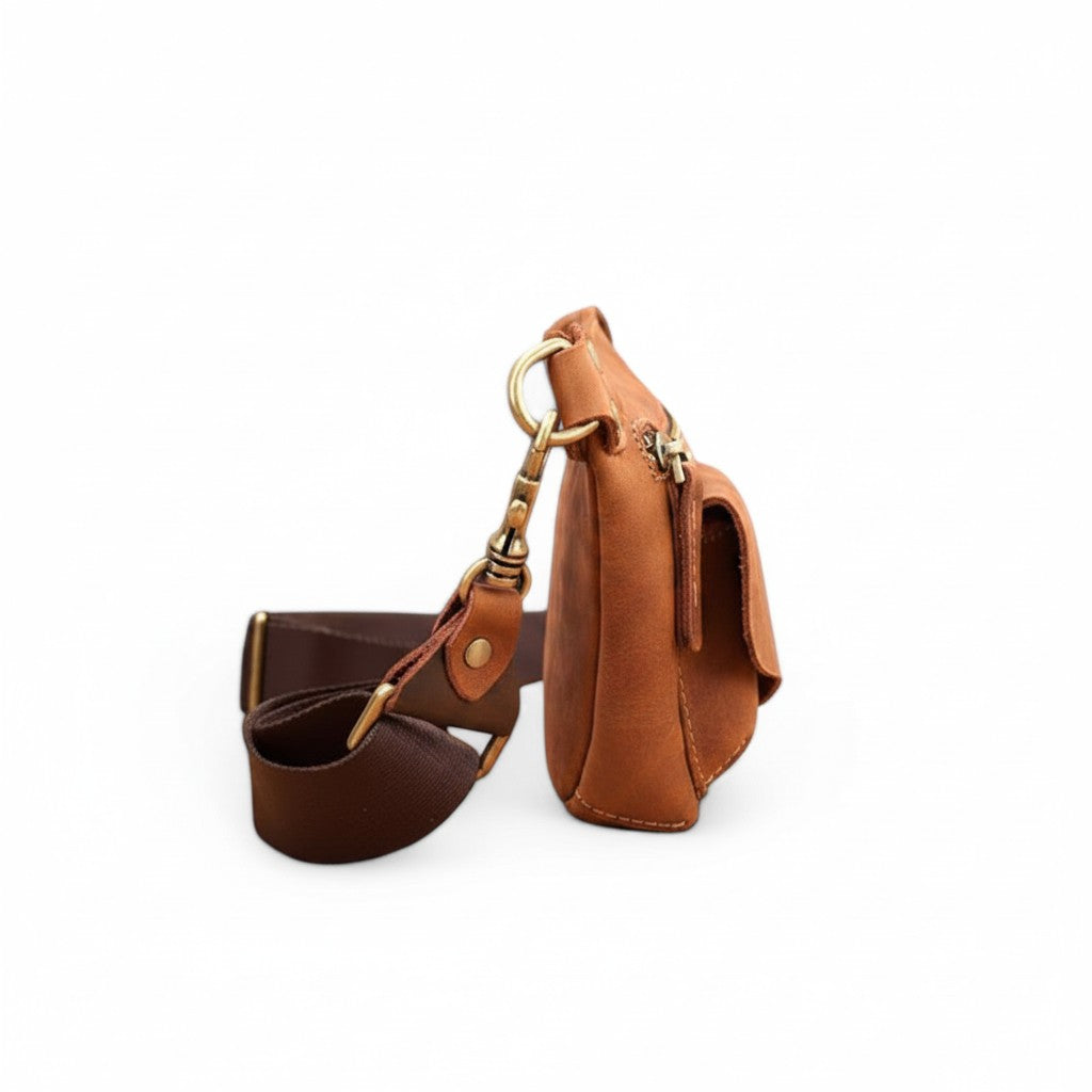 Barcon Getta Inc ARCBAND fanny bag in brown full grain leather with multiple carrying styles and zippered pockets.