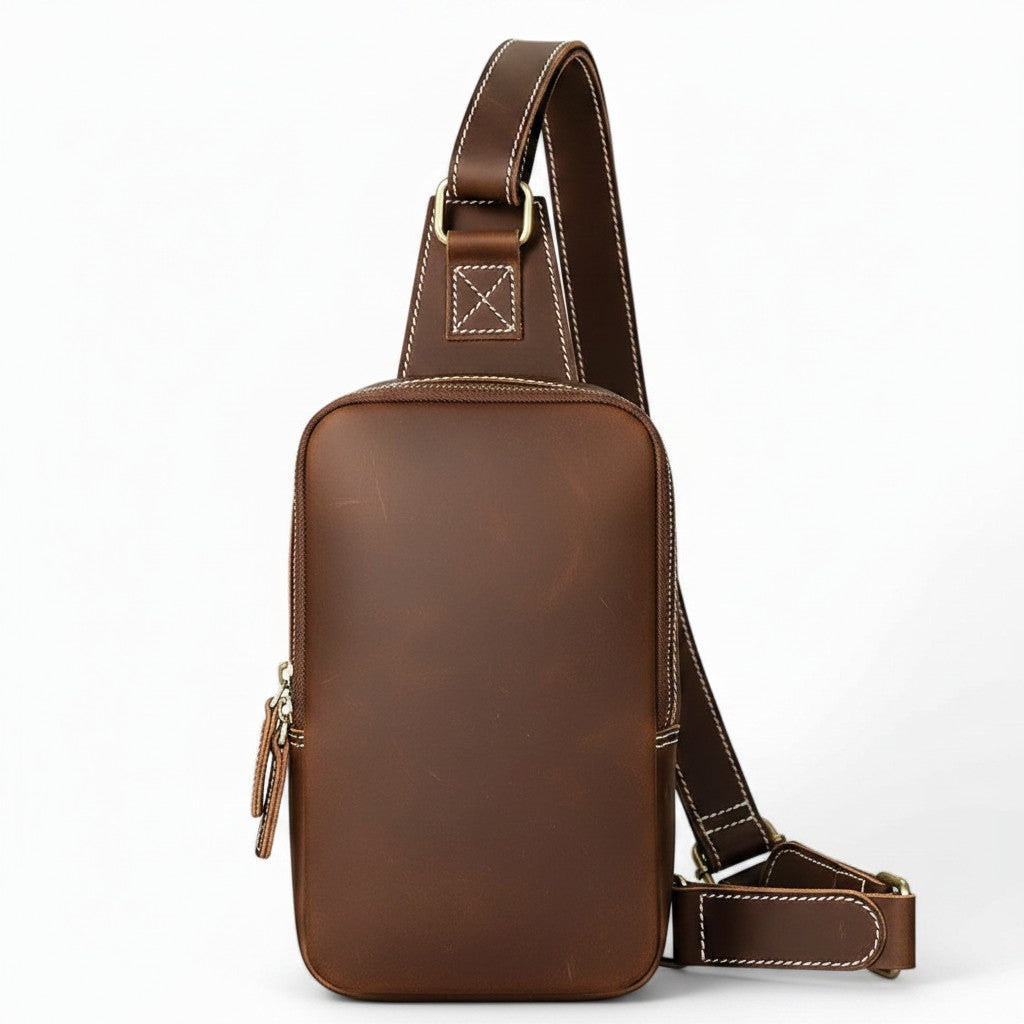 Barcon Getta Inc brown leather cross-body bag with adjustable strap and multiple zippered compartments.