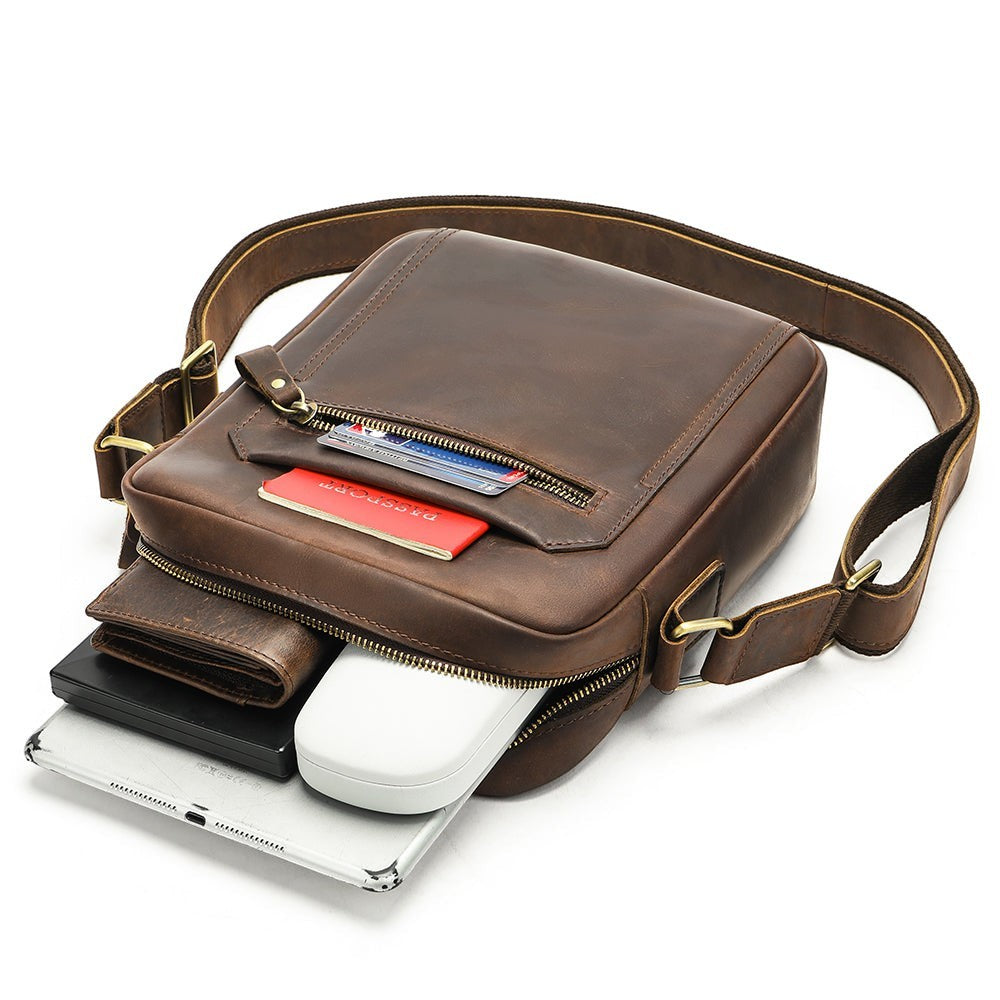 Barcon Getta Inc brown full grain leather crossbody bag with multiple pockets, ideal for travel.