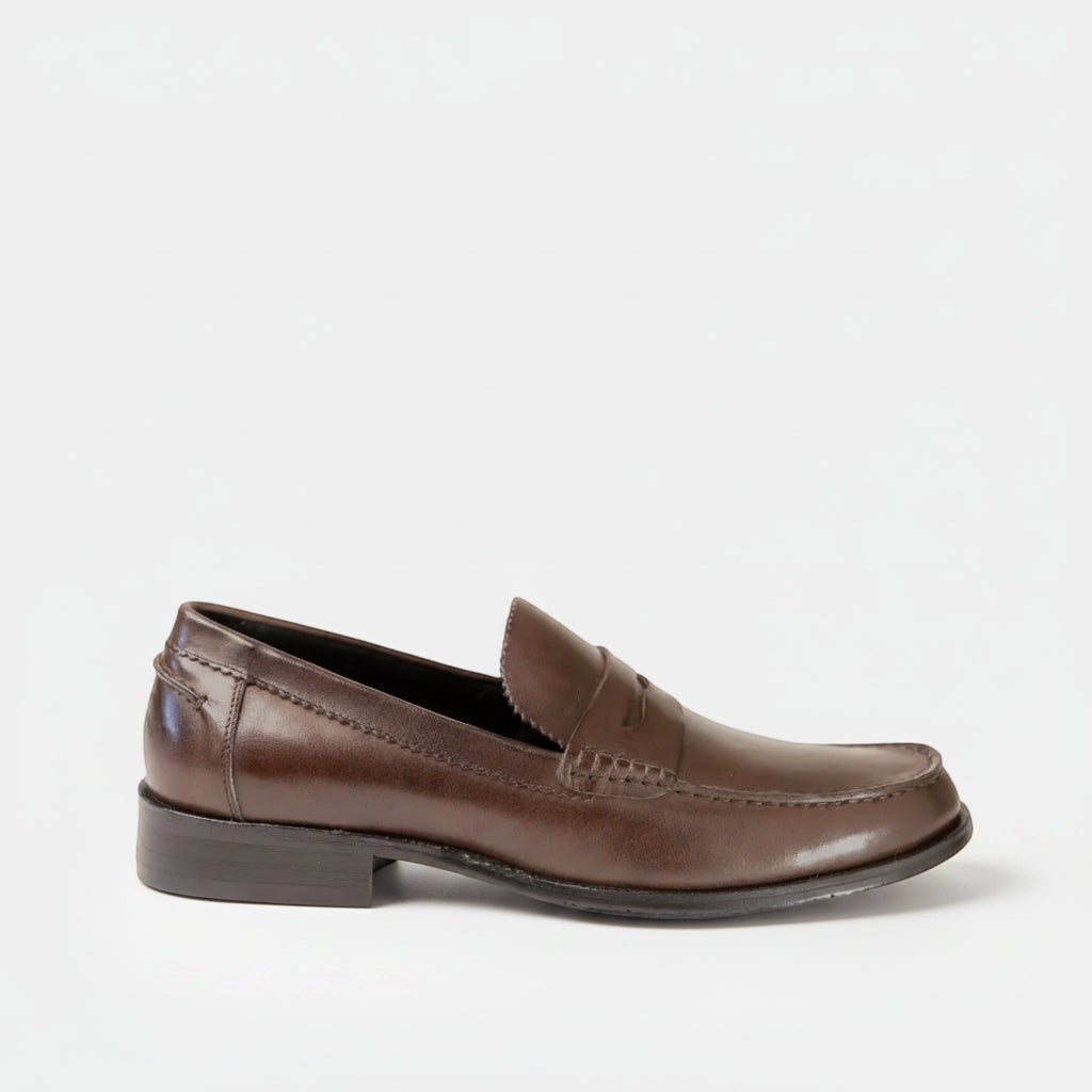 Barcon Getta Inc ABUJA brown leather penny loafer with a sleek silhouette and traditional penny strap detailing.