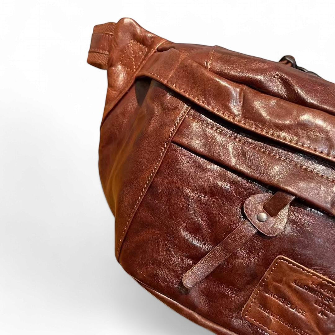 Barcon Getta Inc AXUMAWIT fanny bag in rich brown full grain leather with multiple zipper pockets and a soft touch finish.