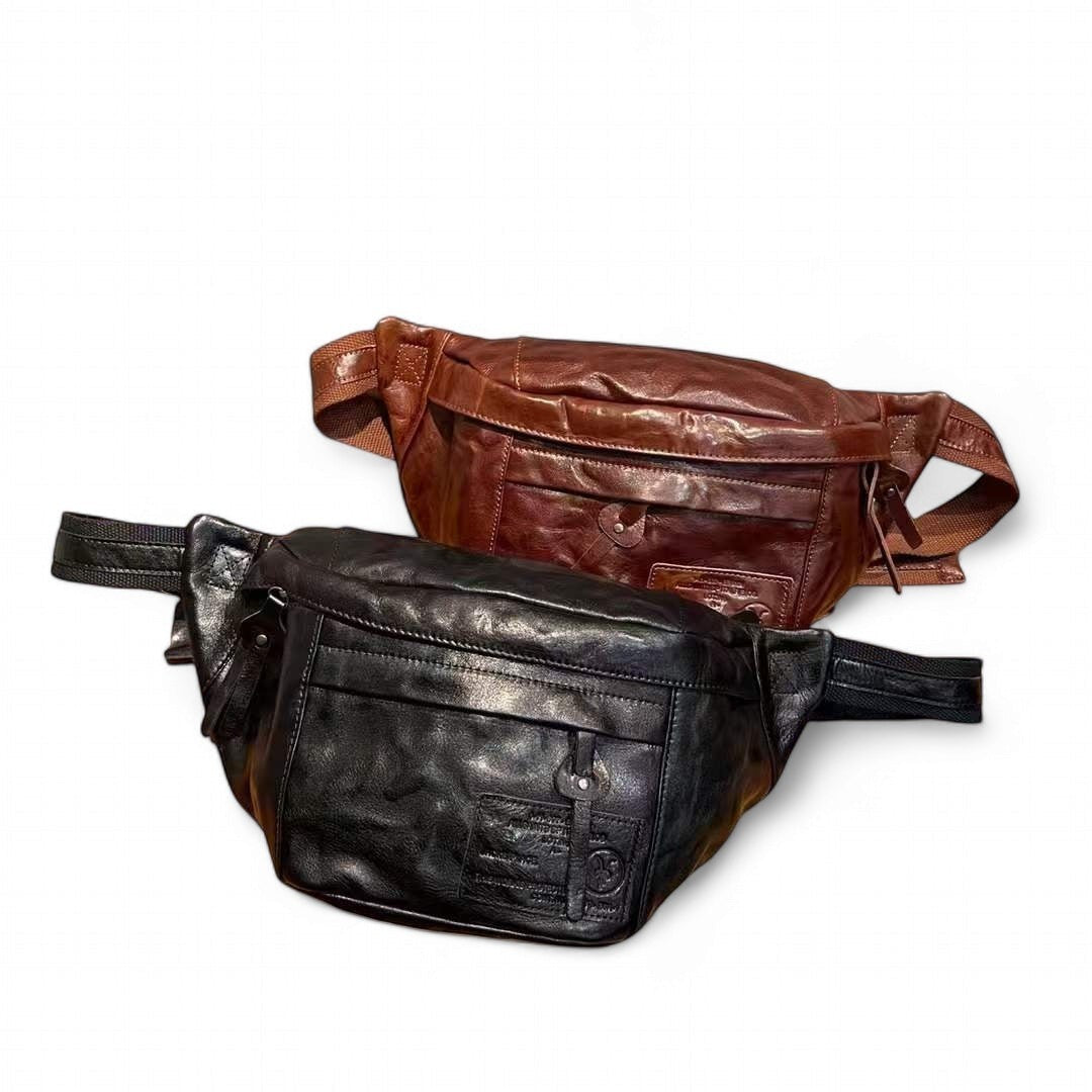 Barcon Getta Inc AXUMAWIT fanny bag in black and brown full grain leather with multiple zipper pockets and adjustable strap.