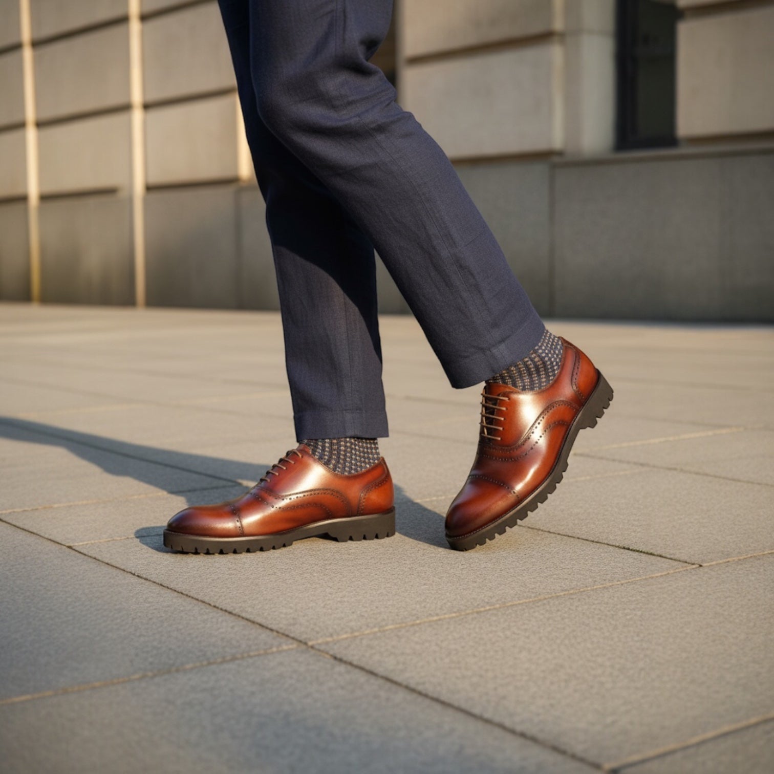 Barcon Getta Inc BANJUL cognac brown leather wingtip Oxford dress shoes with brogue perforations and lug sole.