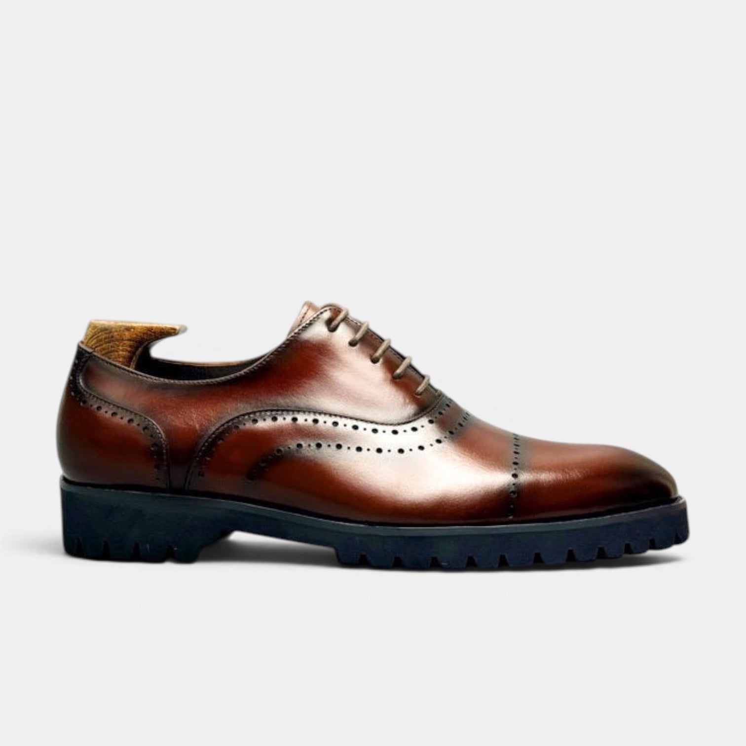 Barcon Getta Inc BANJUL cognac brown leather wingtip oxford dress shoes with brogue perforations and chunky lug sole.