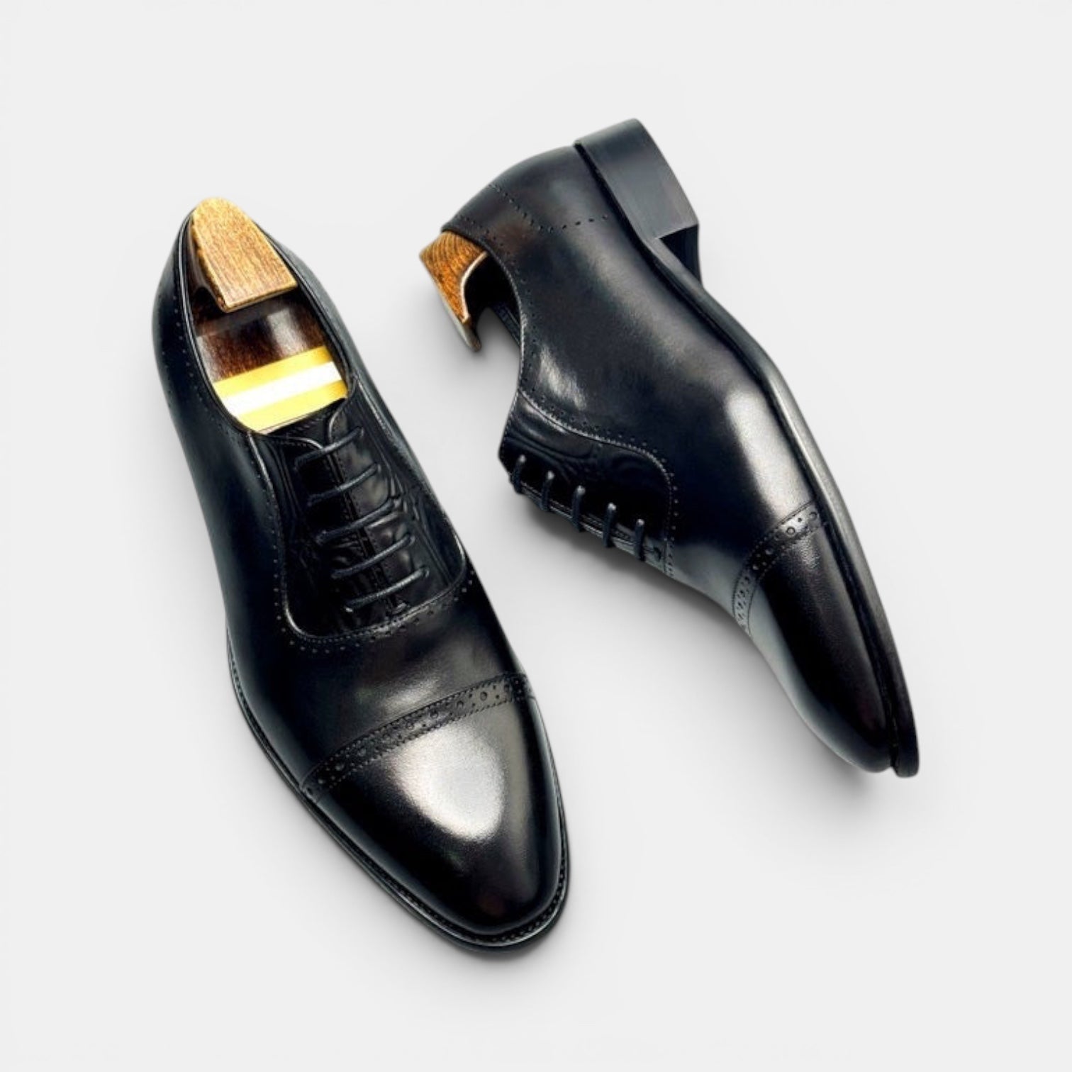 Barcon Getta Inc BISSAU gunmetal black full grain leather cap toe Oxford dress shoes with brogue perforations.