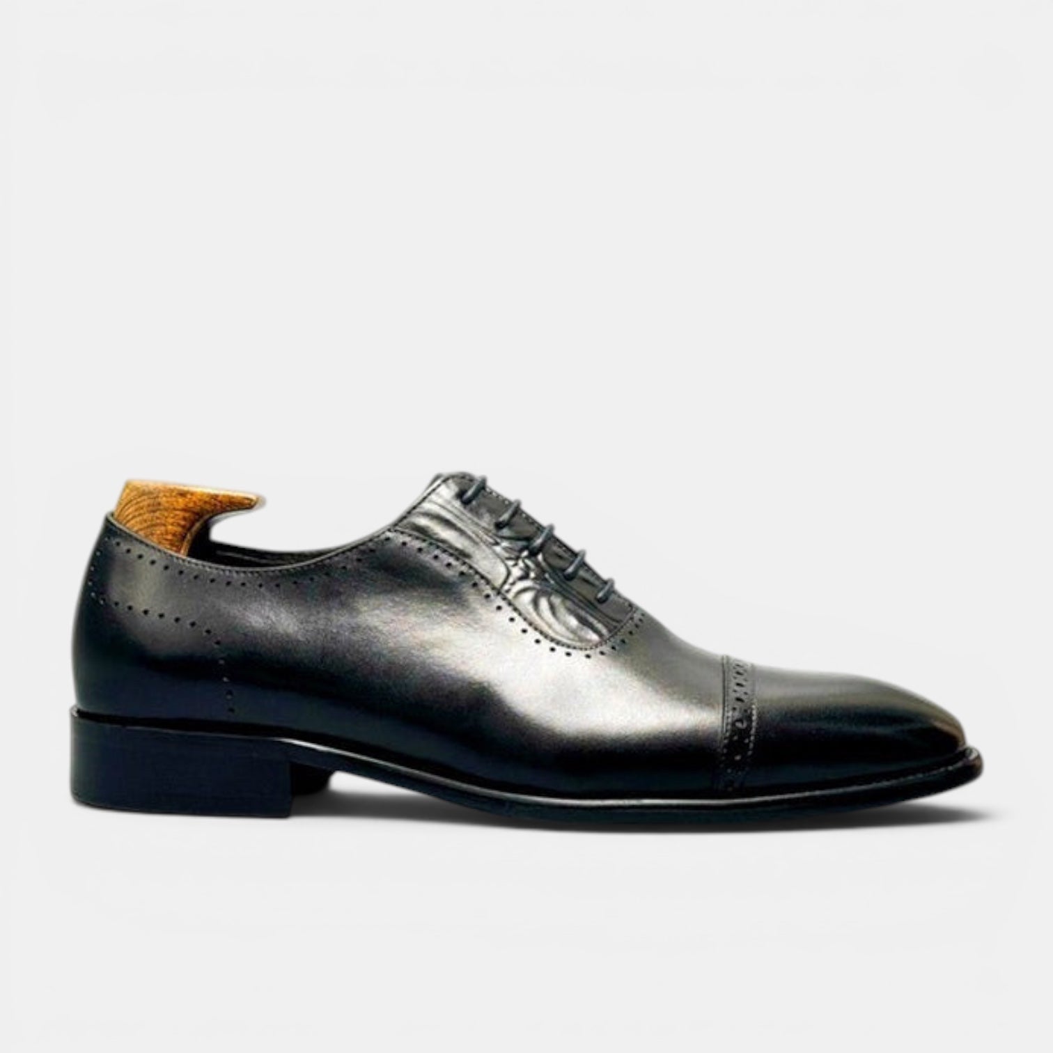 Barcon Getta Inc BISSAU gunmetal black full grain leather cap toe Oxford dress shoes with brogue perforations.