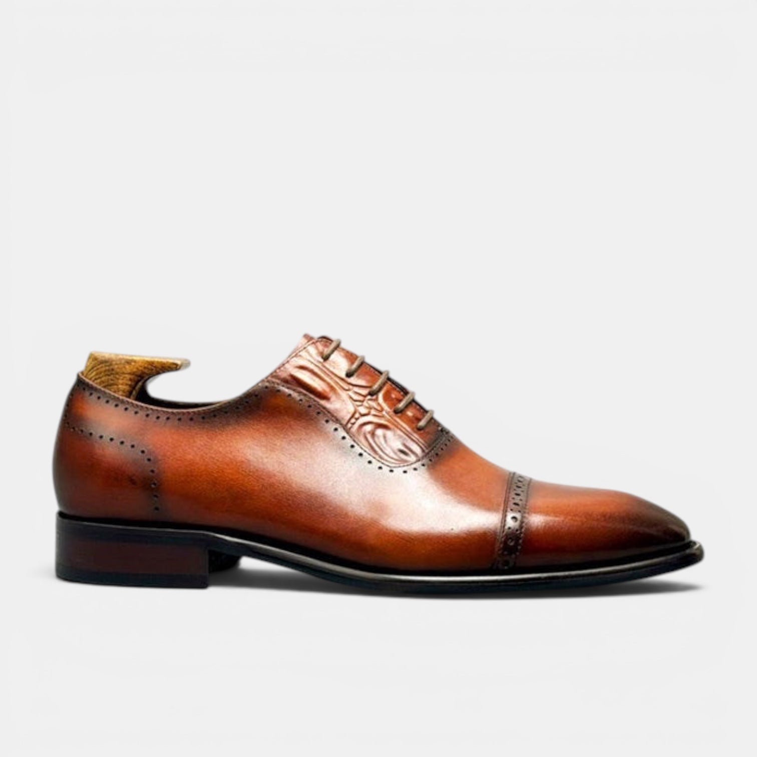 Barcon Getta Inc BISSAU burnished tan full grain leather cap toe Oxford dress shoes with brogue perforations and scroll embossing.