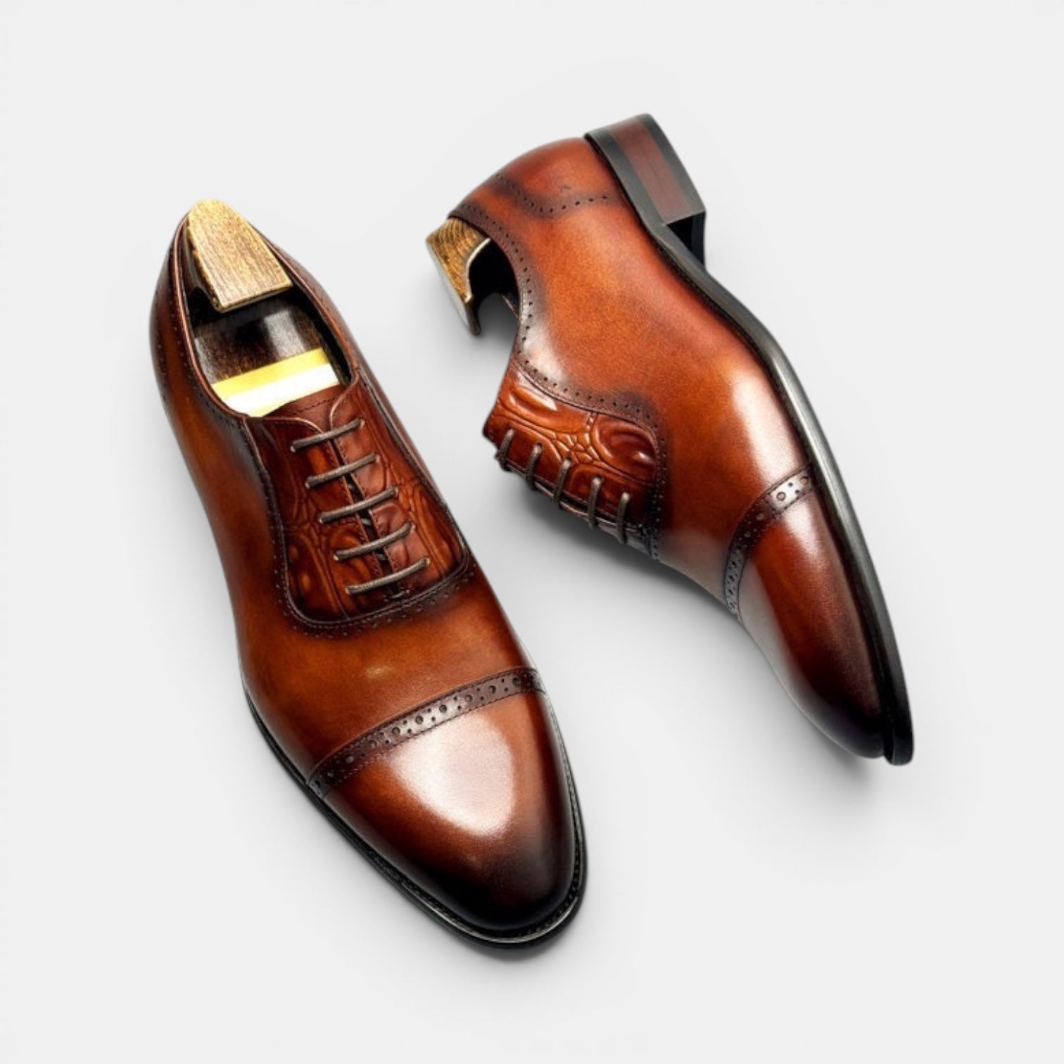 Barcon Getta Inc BISSAU burnished tan full grain leather cap toe Oxford dress shoes with brogue details and embossed tongue.