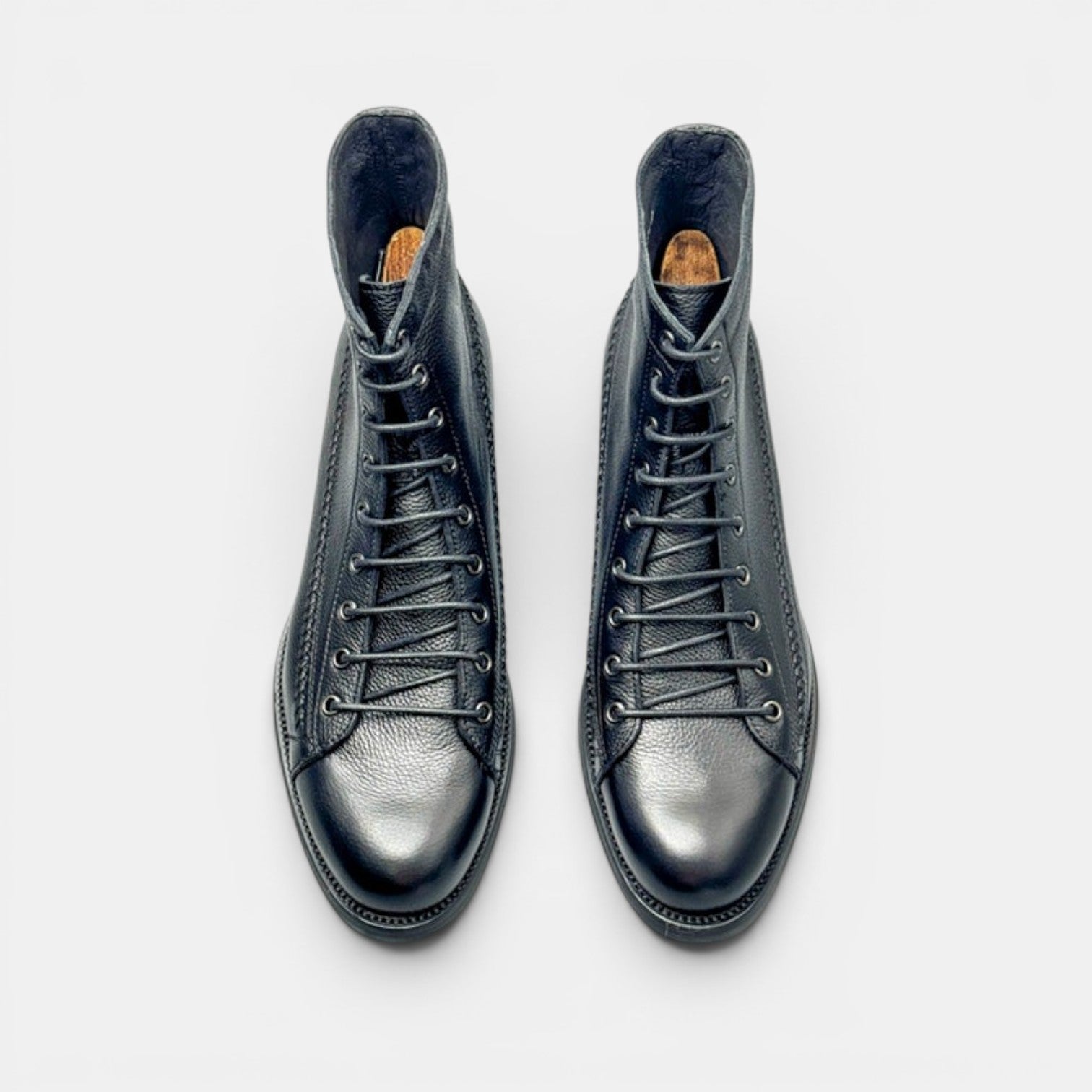 Barcon Getta Inc black leather lace-up ankle boots with textured finish and durable construction.