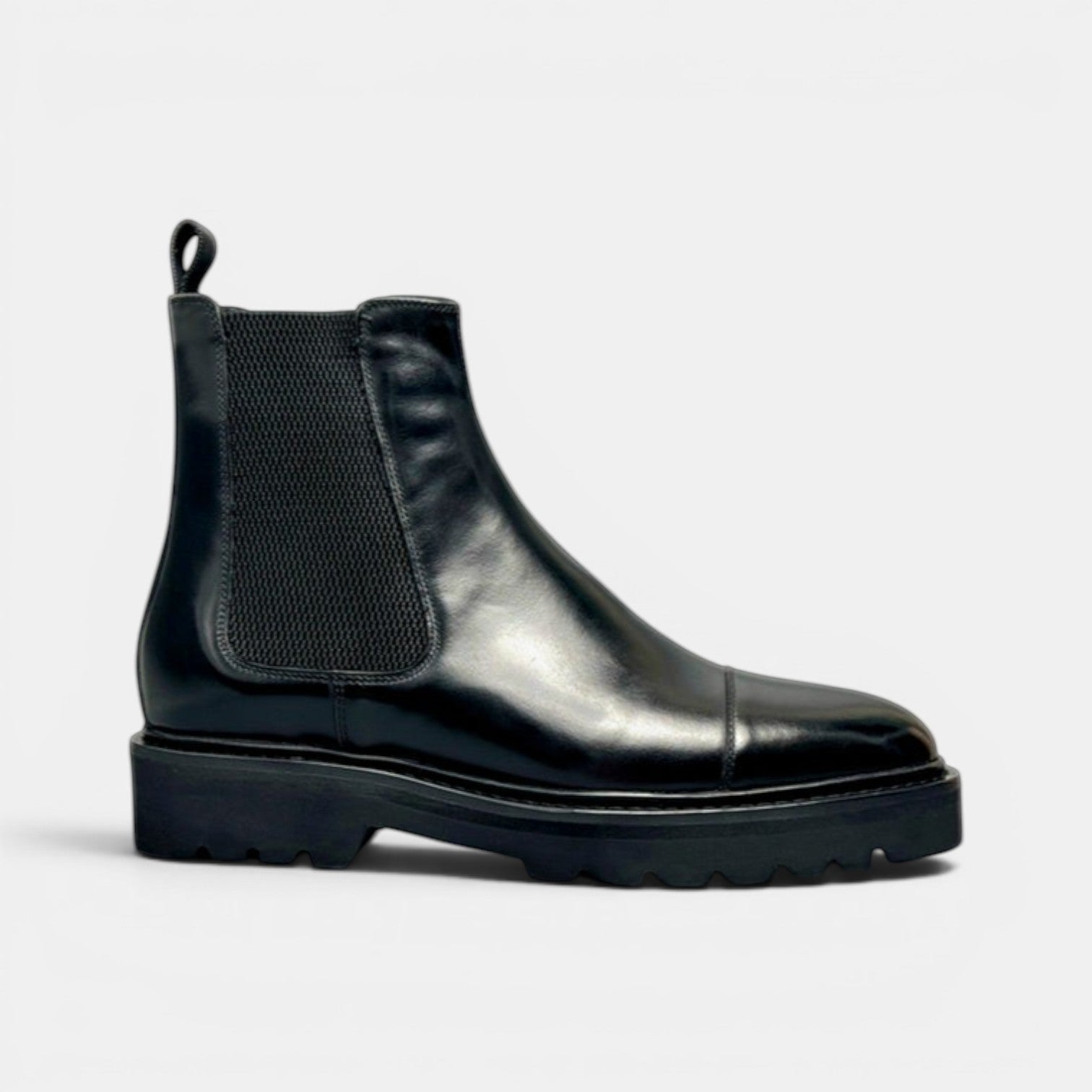 Barcon Getta Inc black leather Chelsea boots with elastic side panels and lug sole.