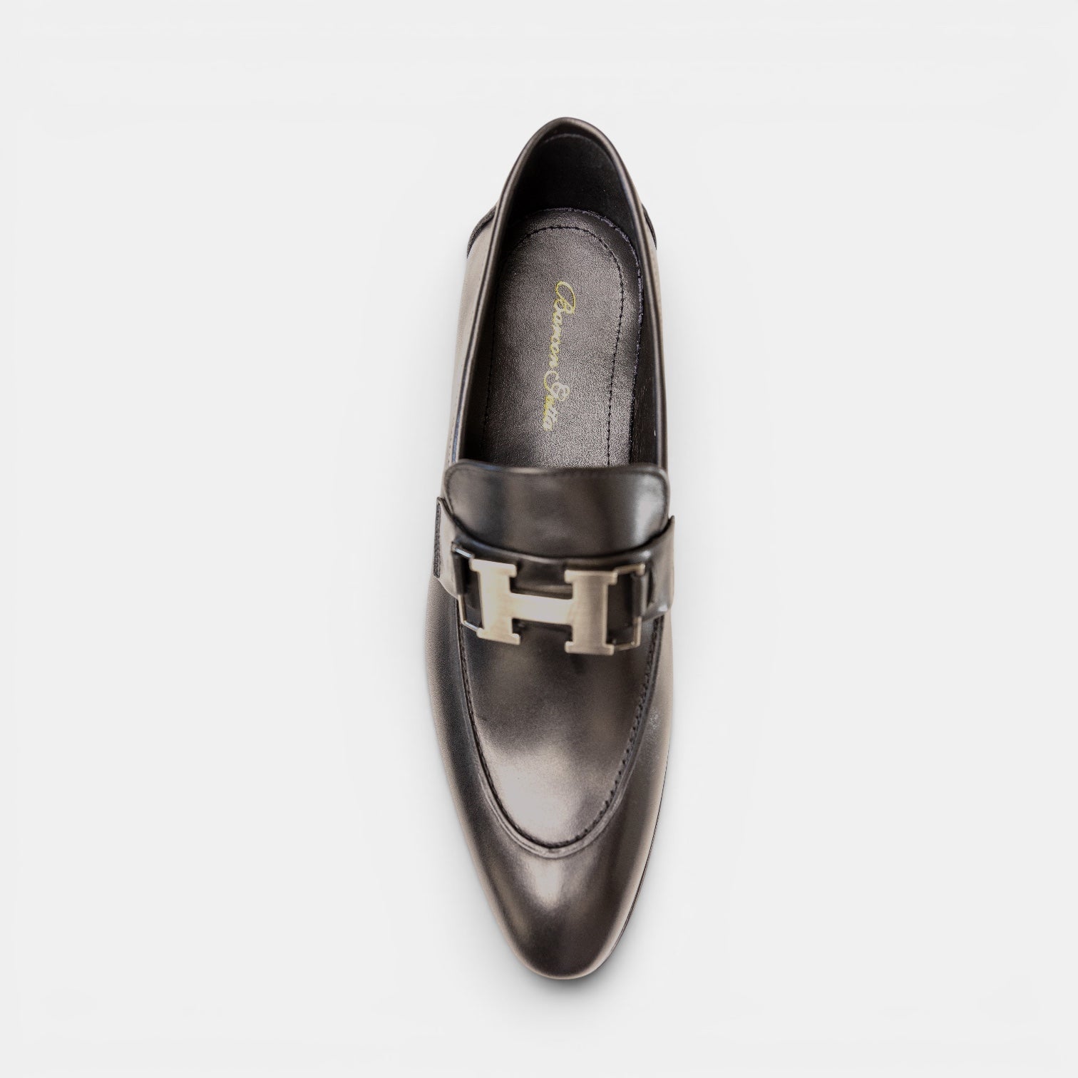 Barcon Getta Inc black leather loafers with silver-tone H horsebit detail. Smooth leather lining and durable sole.