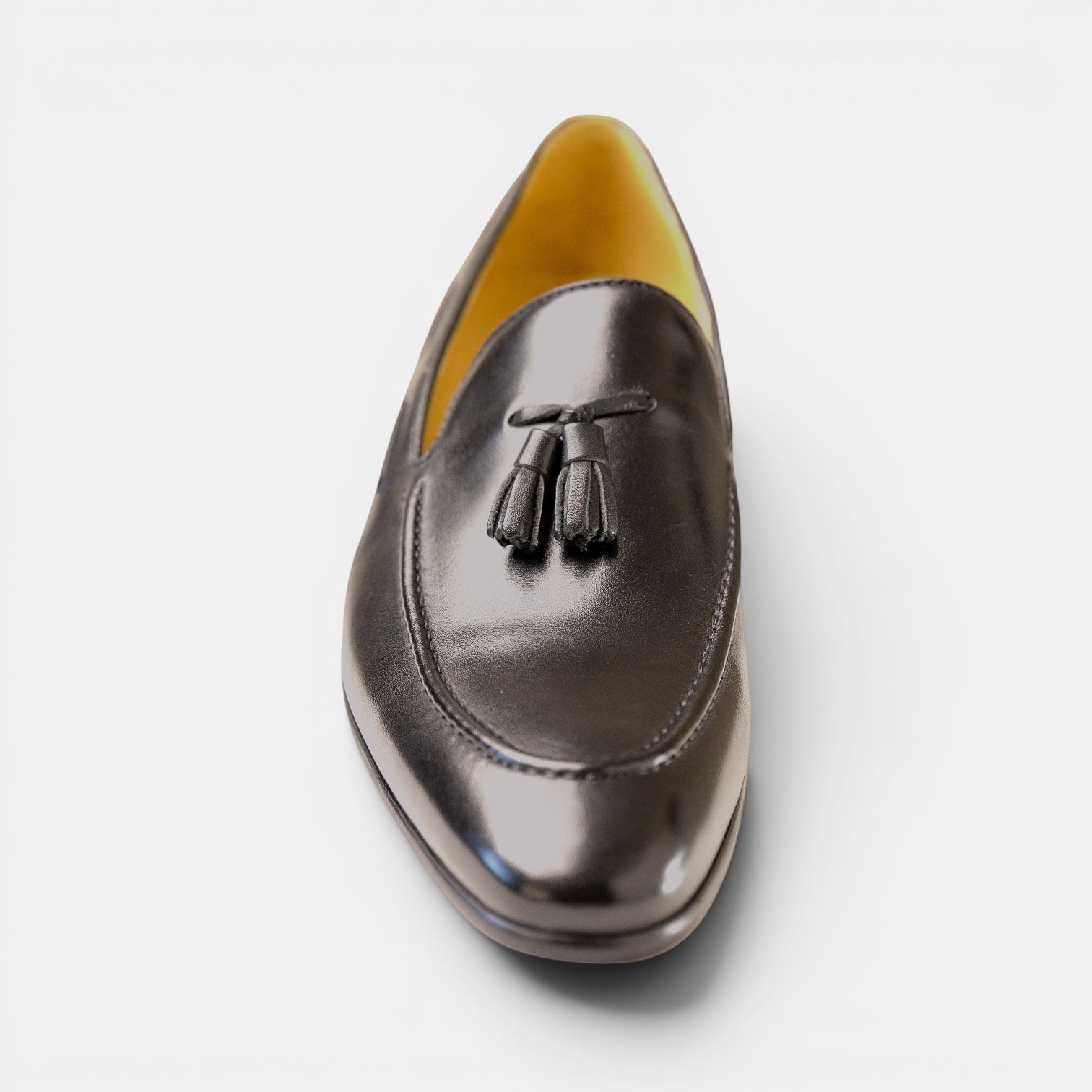 Barcon Getta Inc. black full grain leather tassel loafer with a patent-like finish and amber lining.