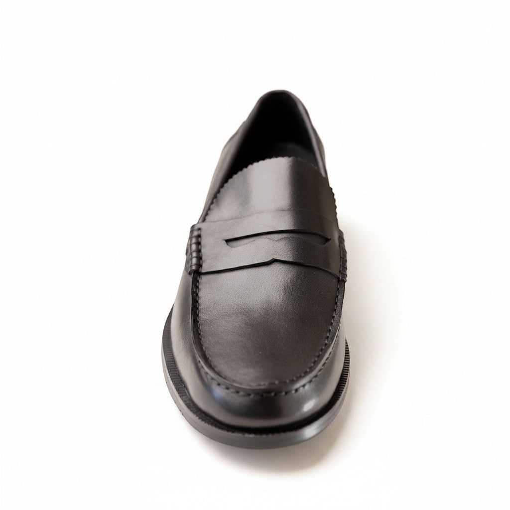 Barcon Getta Inc ABUJA black leather penny loafers with traditional strap detail and stitched accents.