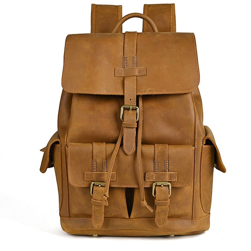 Barcon Getta Inc brown genuine leather Sharp-Carry backpack with brass hardware and multiple exterior pockets.