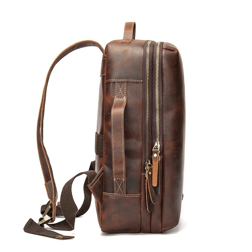 Barcon Getta Inc brown leather TravelLite backpack with dual zippers and adjustable straps.