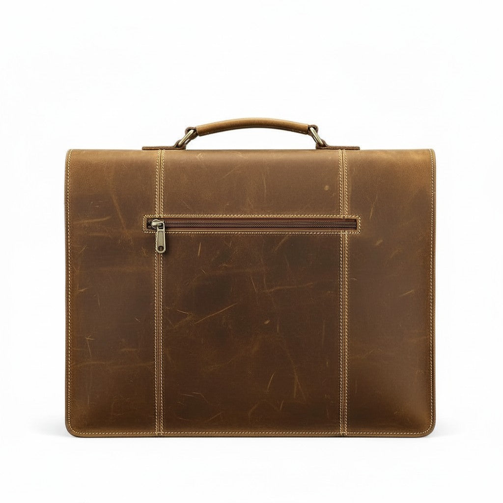 Barcon Getta Inc brown leather briefcase with brass clasp, top handle, and adjustable shoulder strap. Fits up to 16" laptop.