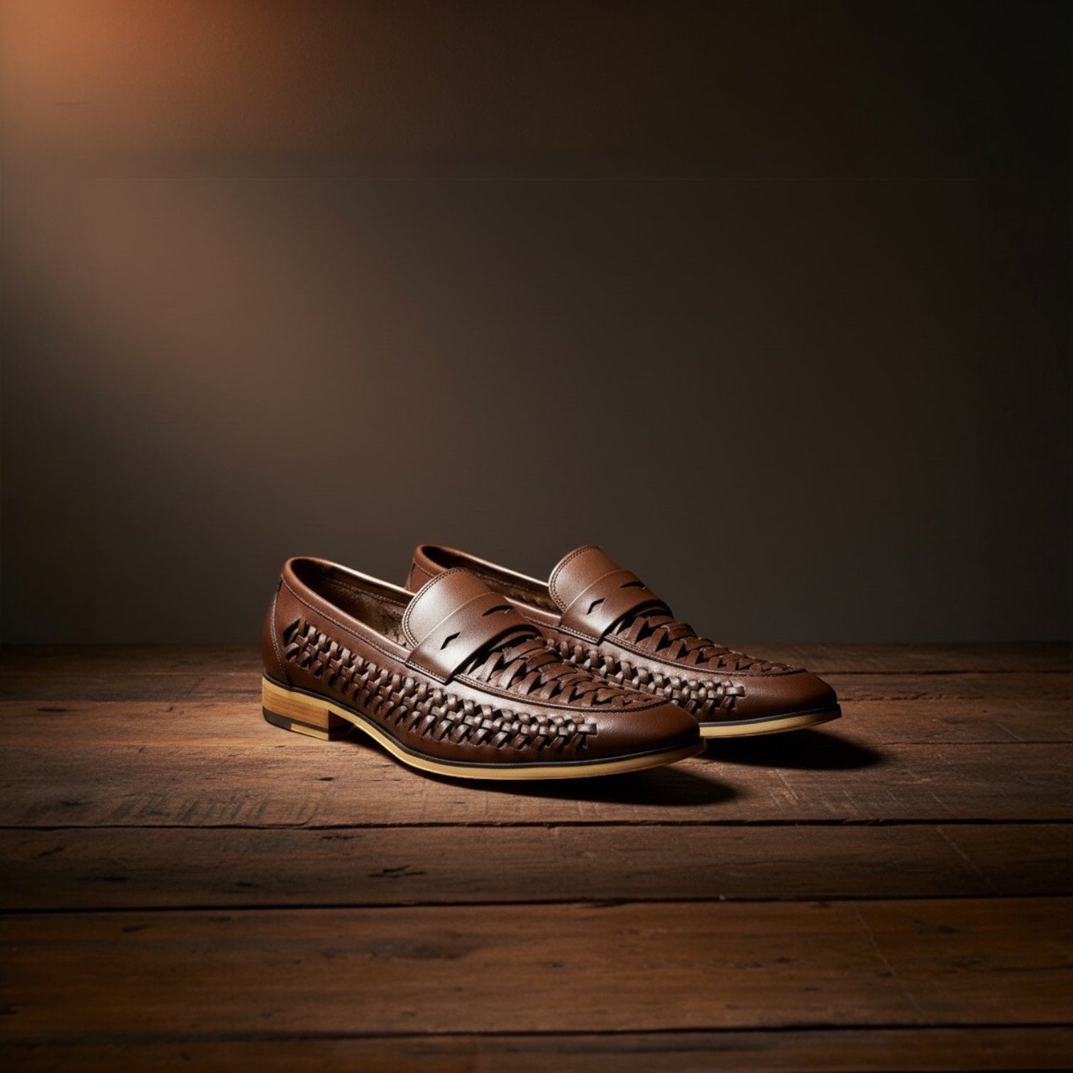 Barcon Getta Inc MASSAWA brown leather woven slip-on loafers with a classic penny loafer strap.