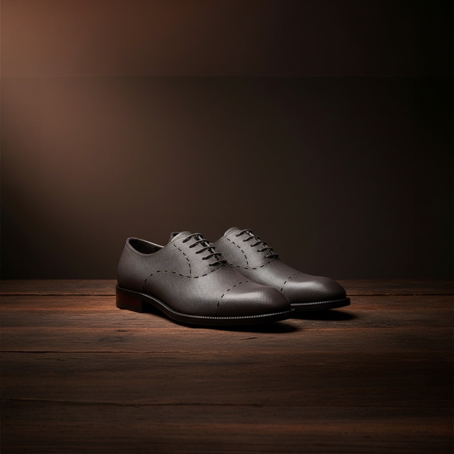Barcon Getta Inc. charcoal grey Saffiano embossed leather Oxford dress shoes with decorative stitching.