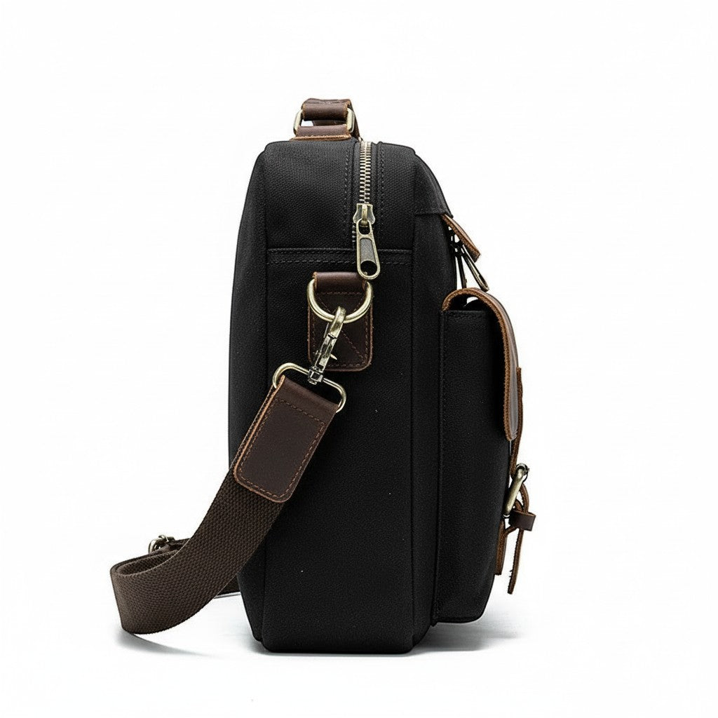 Barcon Getta Inc The Classic grey canvas and leather messenger bag with adjustable strap and multiple pockets.