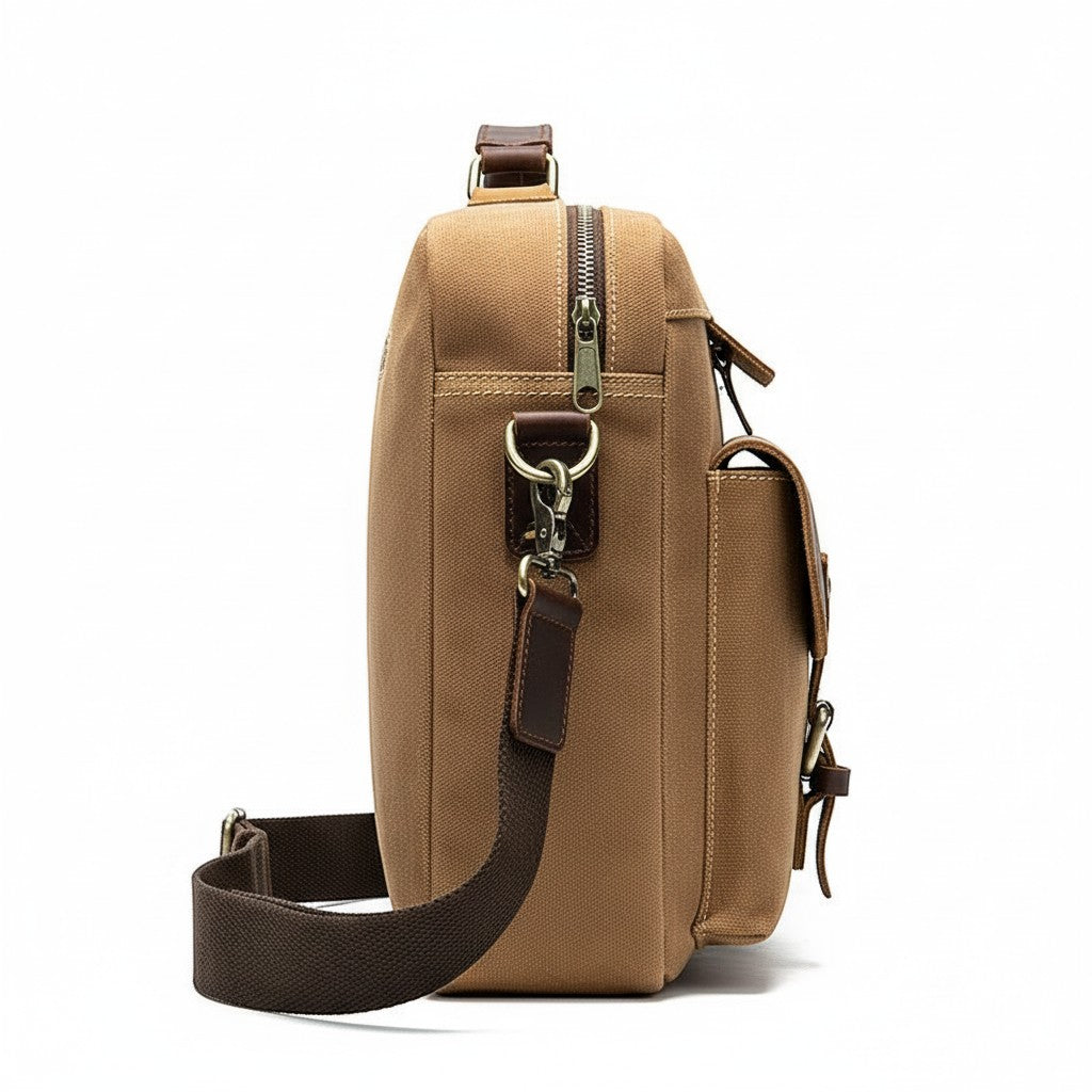 Barcon Getta Inc The Classic grey canvas messenger bag with leather accents, multiple pockets, and adjustable strap.