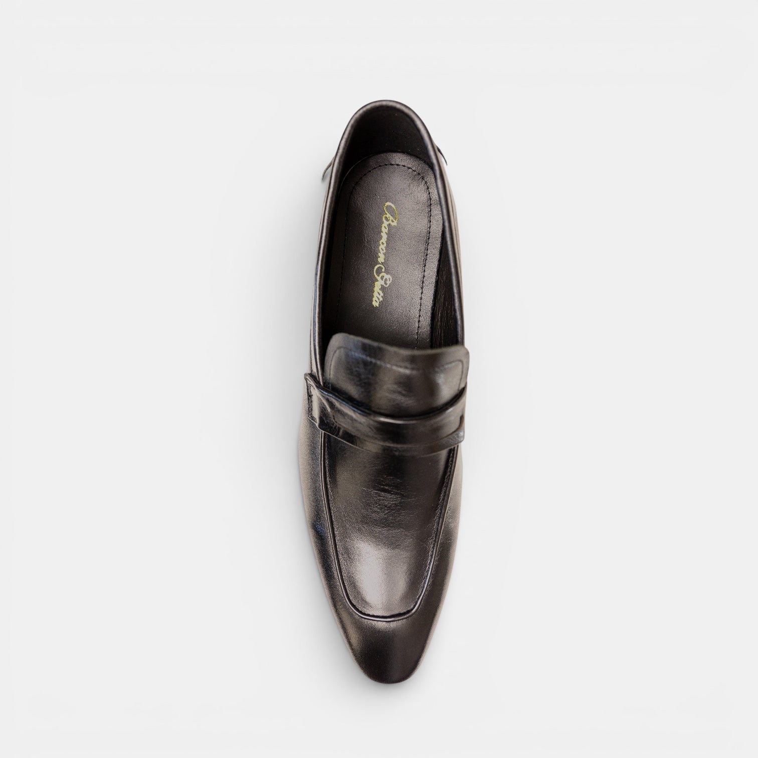 Barcon Getta Inc CONAKRY black high-polish full-grain leather penny loafer with smooth upper and hybrid sole.