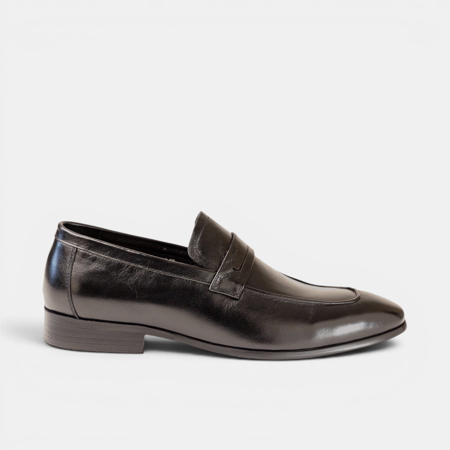 Barcon Getta Inc CONAKRY black full-grain leather penny loafer with smooth upper and hybrid sole.