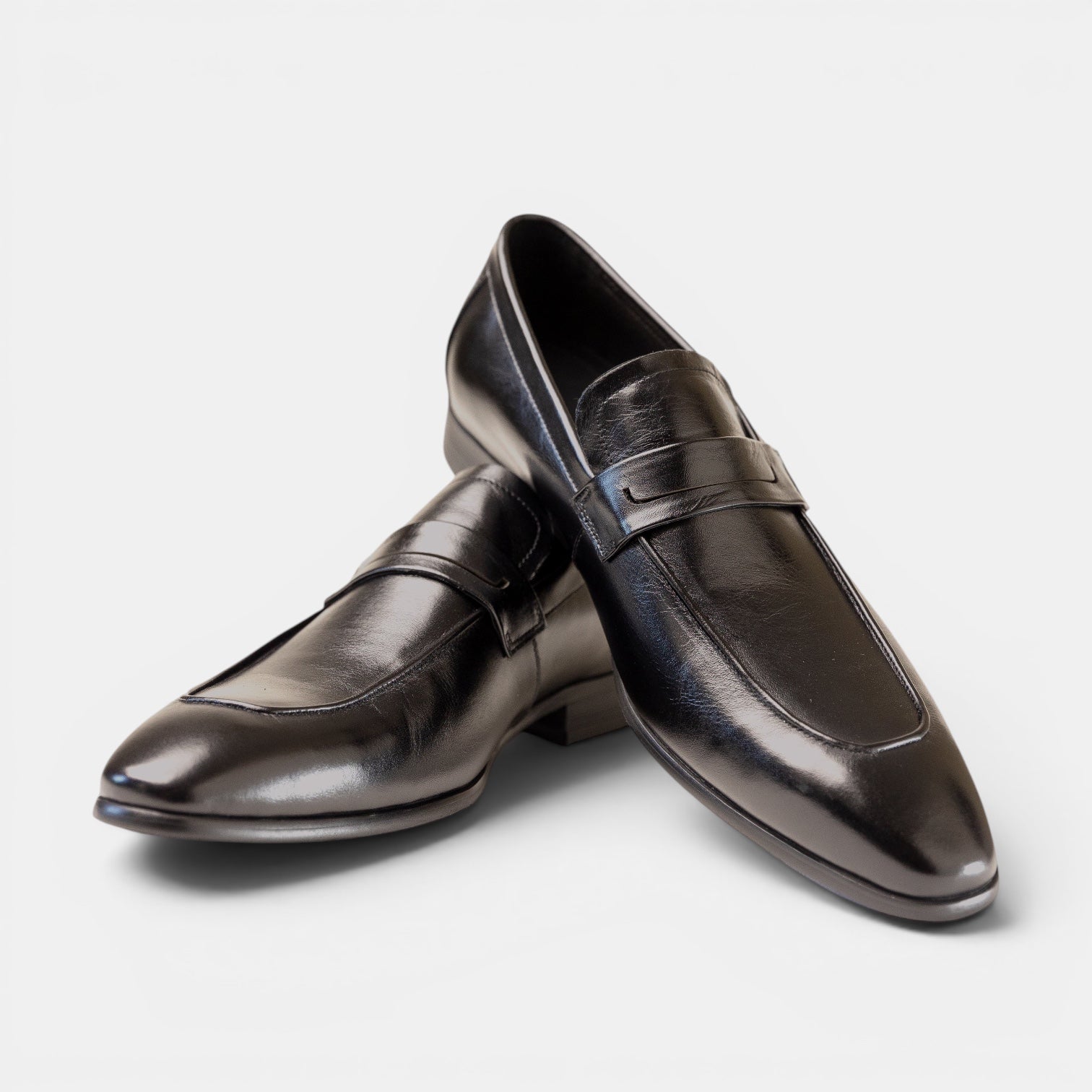 Barcon Getta Inc CONAKRY black high-polish full-grain leather penny loafers with smooth upper and hybrid sole.