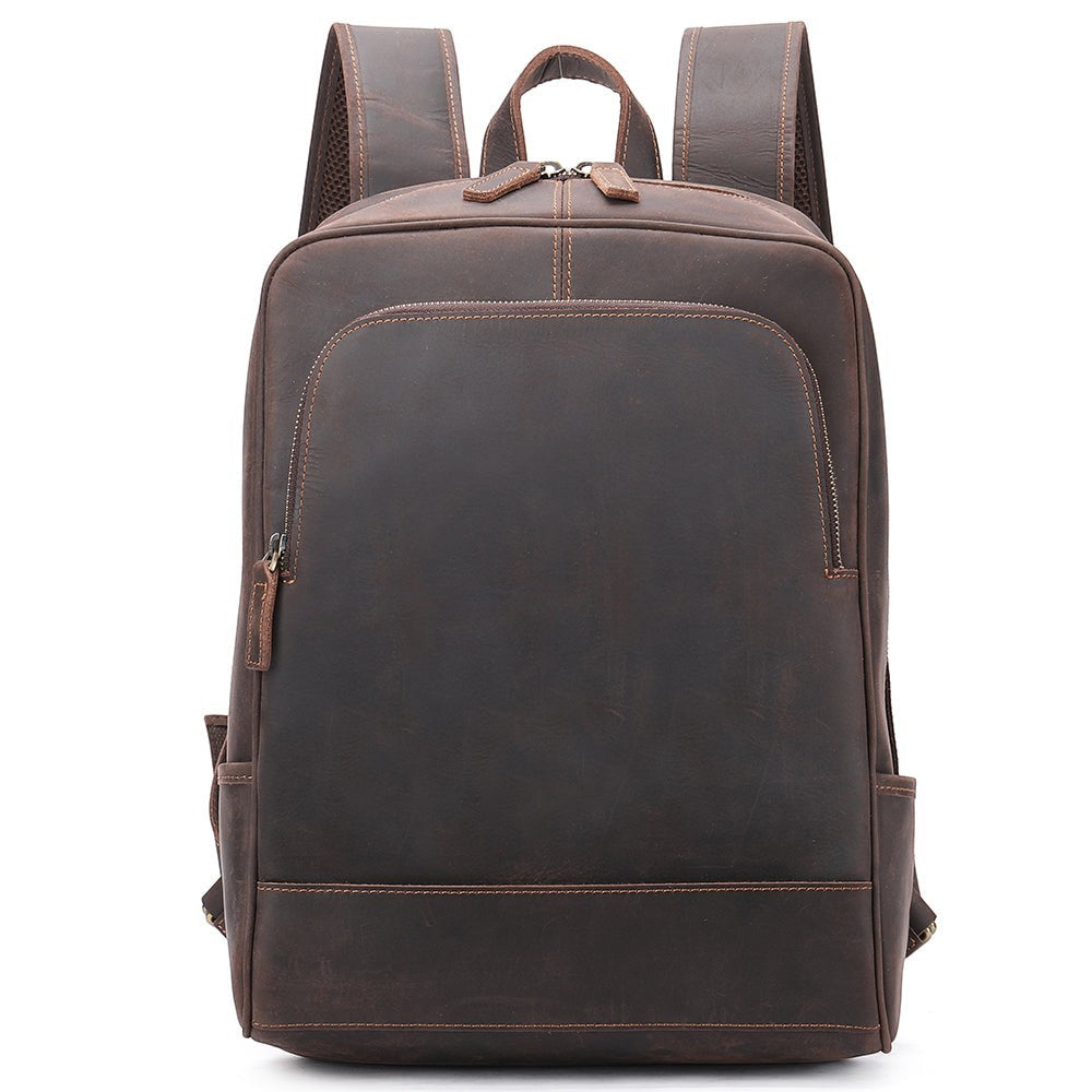 Barcon Getta Inc brown genuine leather backpack with zip pockets and adjustable straps. Classic design for travel or work.
