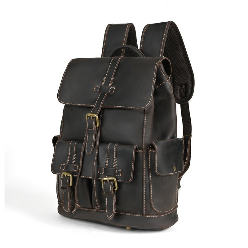 Barcon Getta Inc dark brown genuine leather backpack with brass hardware and multiple exterior pockets.