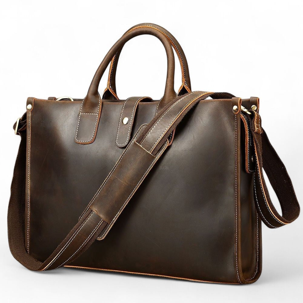 Barcon Getta Inc dark brown handmade Ethiopian leather briefcase with top handles and adjustable strap. Features multiple pockets.