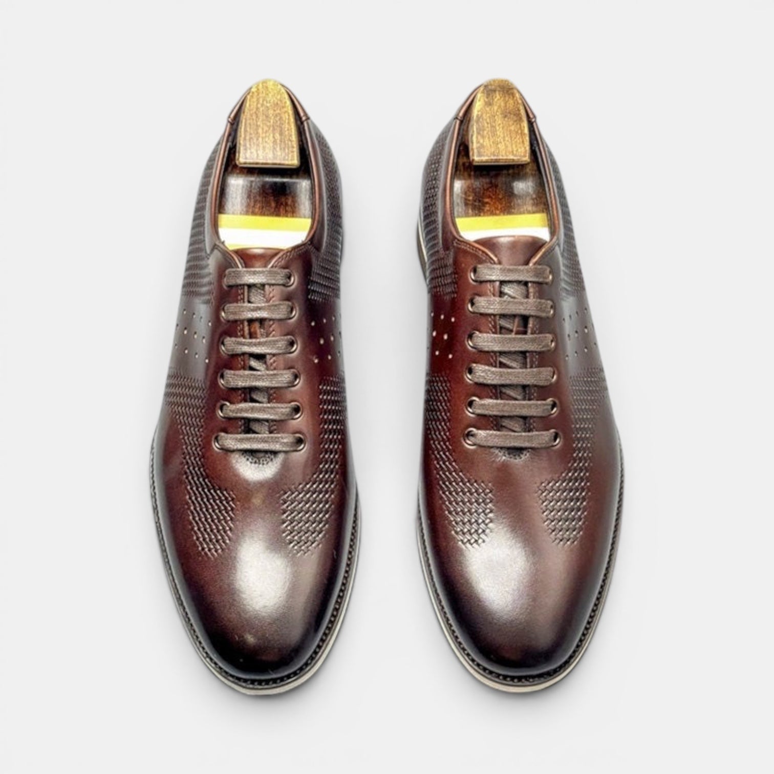 Barcon Getta Inc DESSIE CROSSOVER dark brown full grain leather dress shoes with perforated toe and embossed quarter.