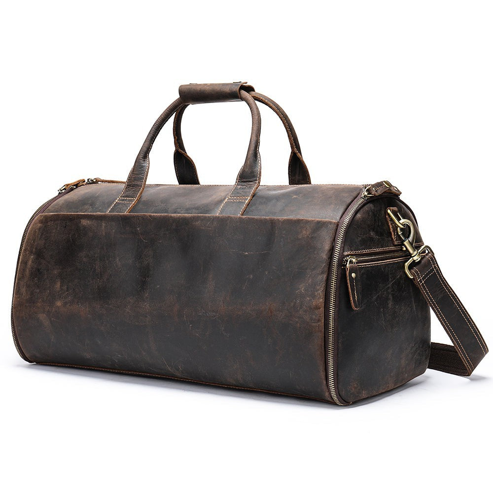 Barcon Getta Inc dark brown distressed leather duffel bag with top handles and shoulder strap for travel.