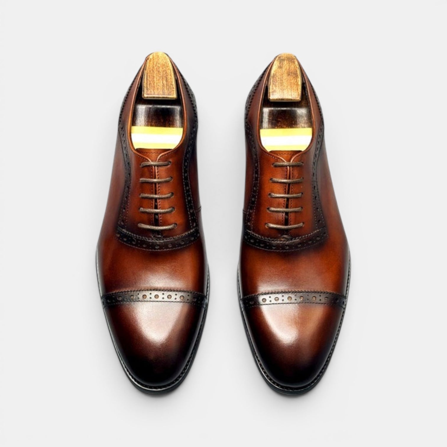 Barcon Getta Inc GITEGA brown full grain leather cap toe Oxford dress shoes with brogue detailing and brass nails.