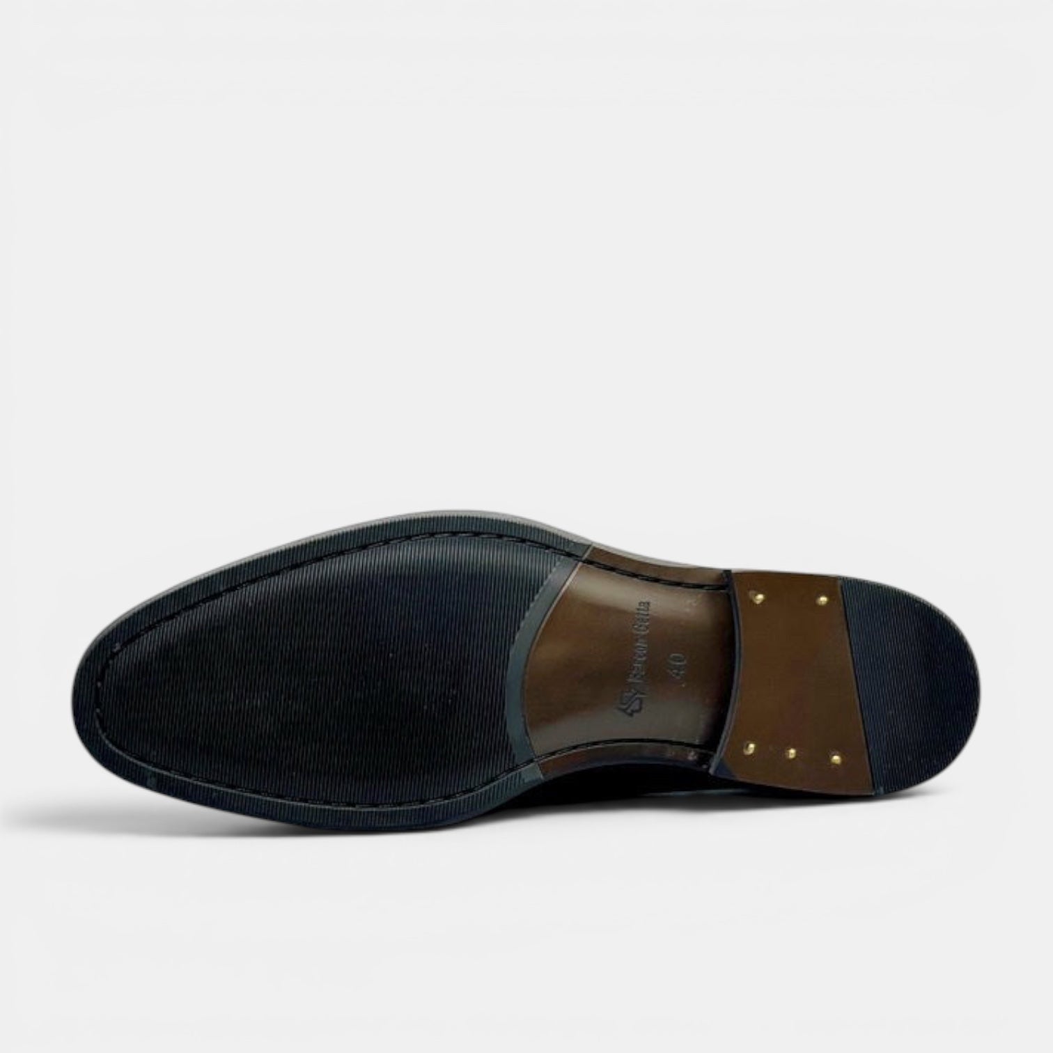 Barcon Getta Inc GITEGA Oxford dress shoes sole view. Black rubber forefoot, brown leather heel with brass nails.
