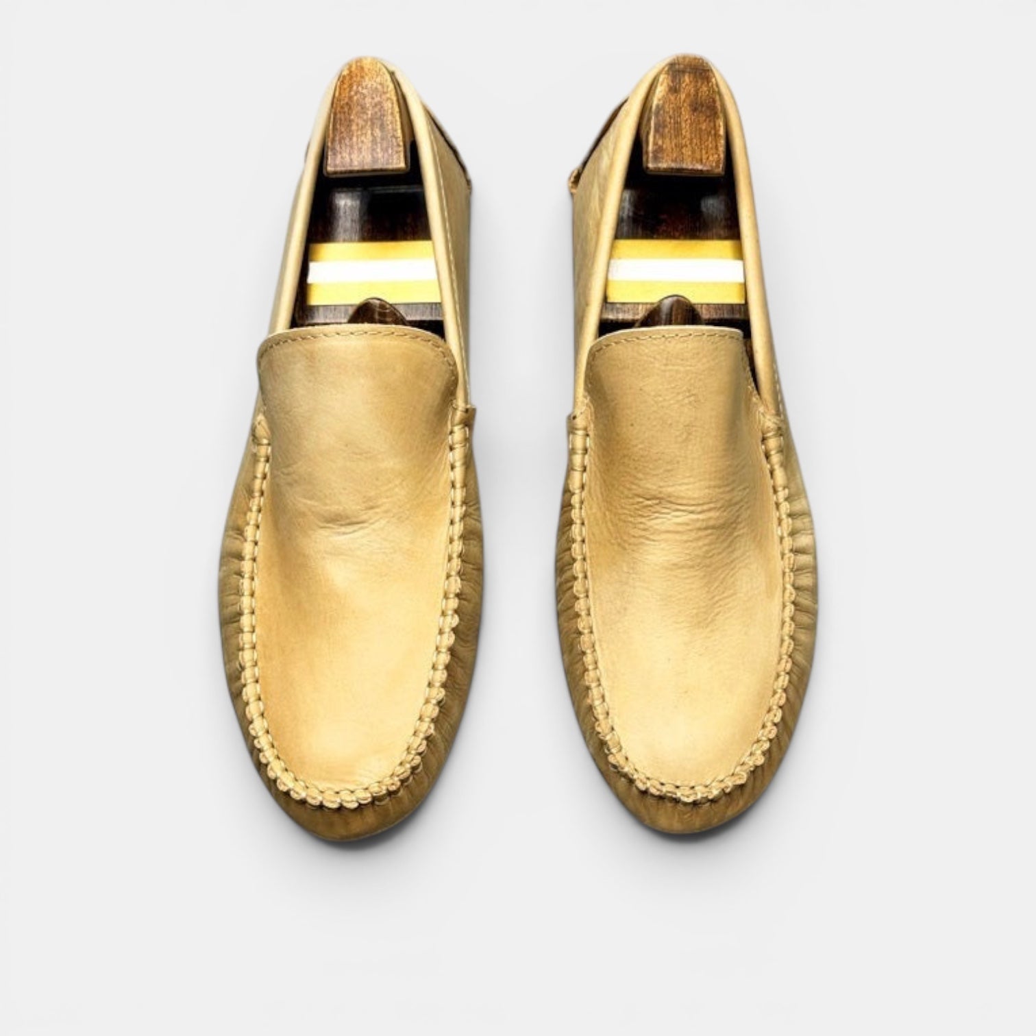 Barcon Getta Inc gold full-grain leather slip-on loafer with hand-stitched moccasin construction and segmented driver sole.