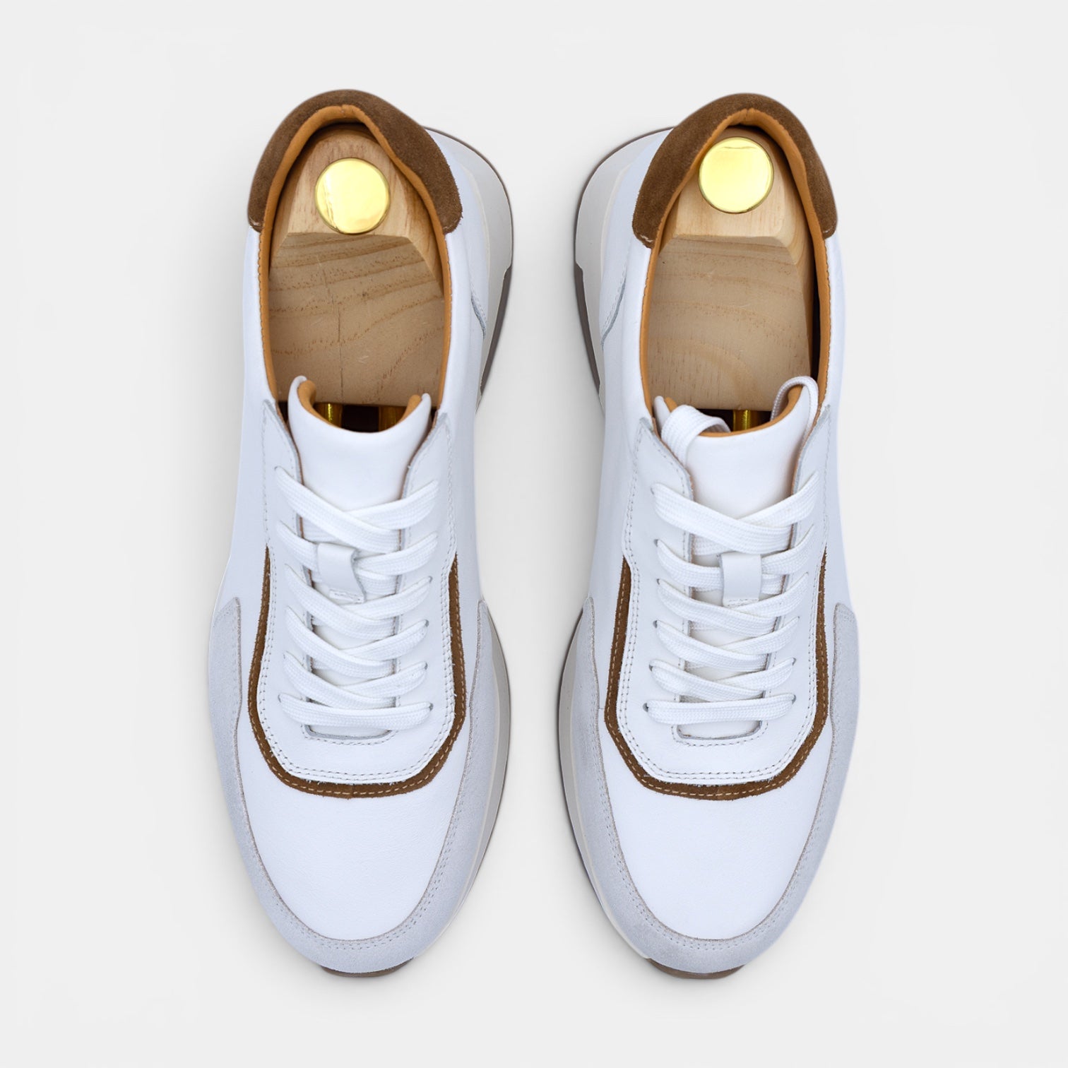 Barcon Getta Inc GUYA sneakers in white leather with tan and grey accents. Two-tone panel construction, round toe, and gum sole.