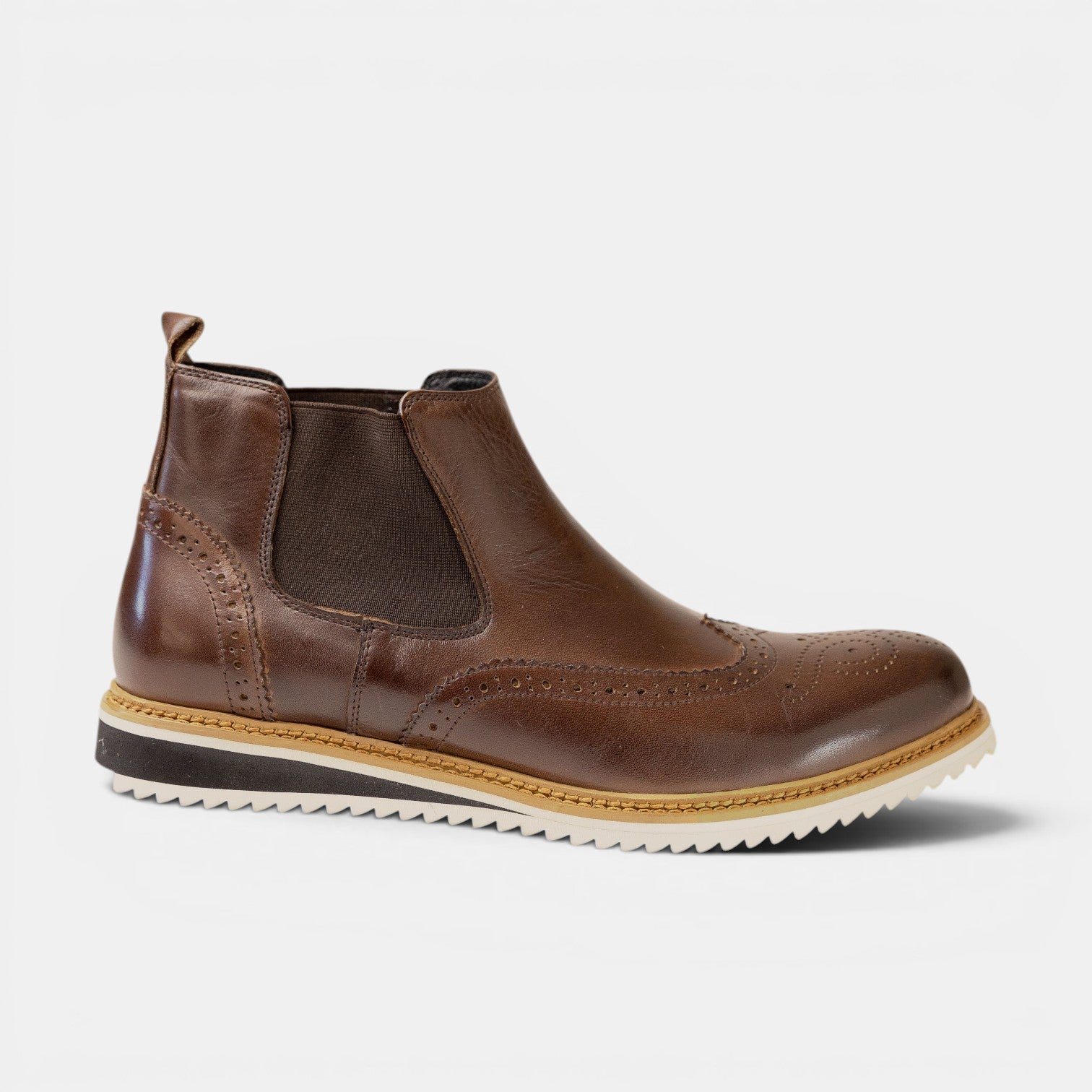 Barcon Getta Inc Johannesburg brown leather wingtip chelsea boots with elastic side panels and a white sole.