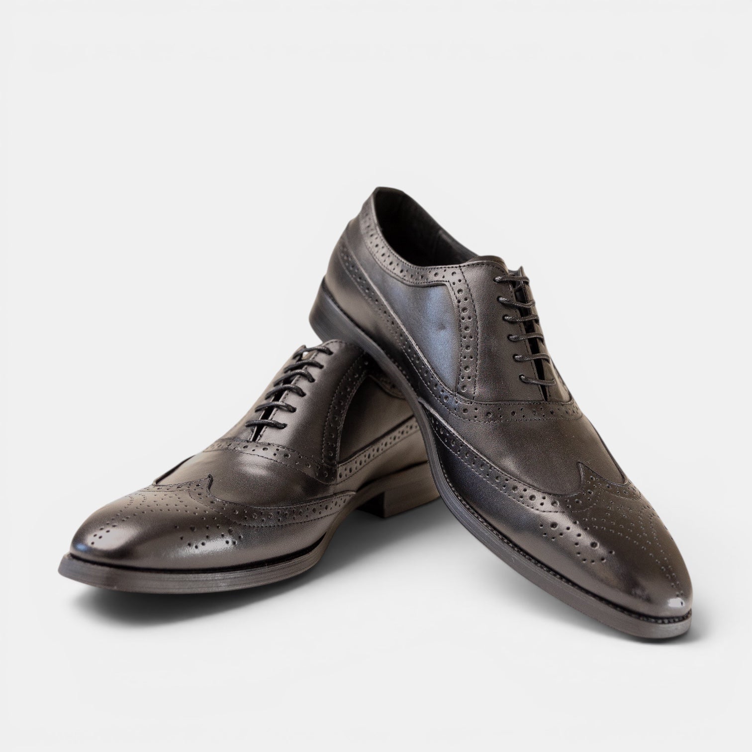 Barcon Getta Inc LOME wingtip Oxford dress shoes in deep charcoal graphite with blue iridescence, full brogue perforations and medallion toe.