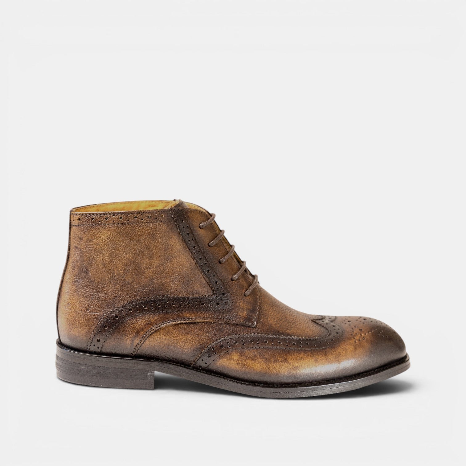 Barcon Getta Inc MAPUTO brown full grain leather wingtip boots with brogue detailing and lace-up closure.