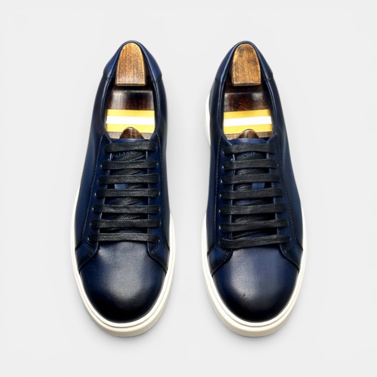 Barcon Getta Inc MEDA LOW TOP sneakers in hand-burnished deep navy full grain leather with white soles and black laces.