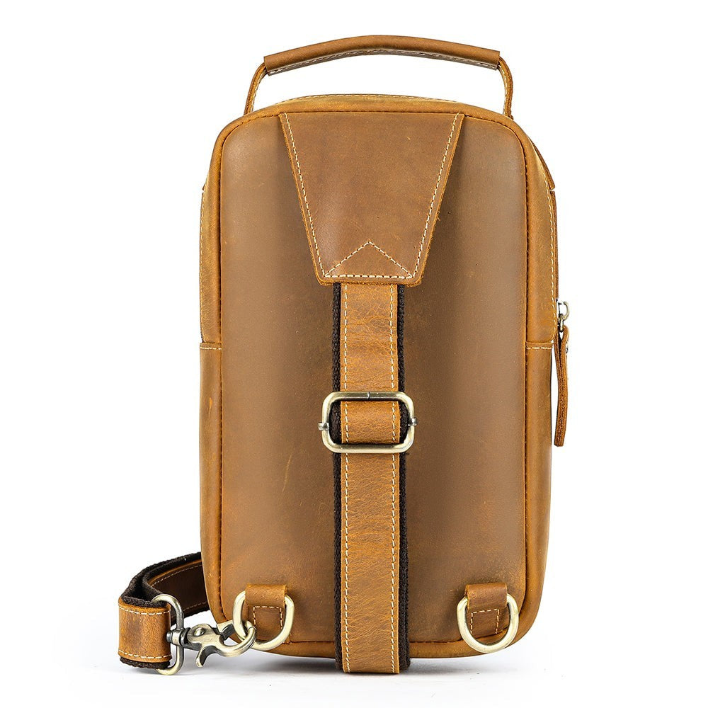 Barcon Getta Inc MERIDIAN vertical brown leather cross-body bag with adjustable strap and zippered compartments.