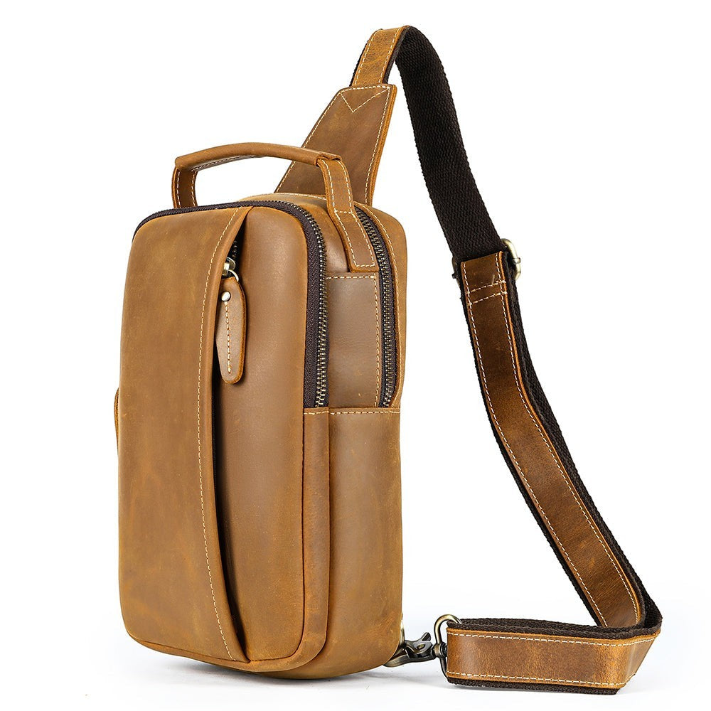 Barcon Getta Inc MERIDIAN brown genuine leather vertical cross-body bag with multiple zippered compartments and adjustable strap.