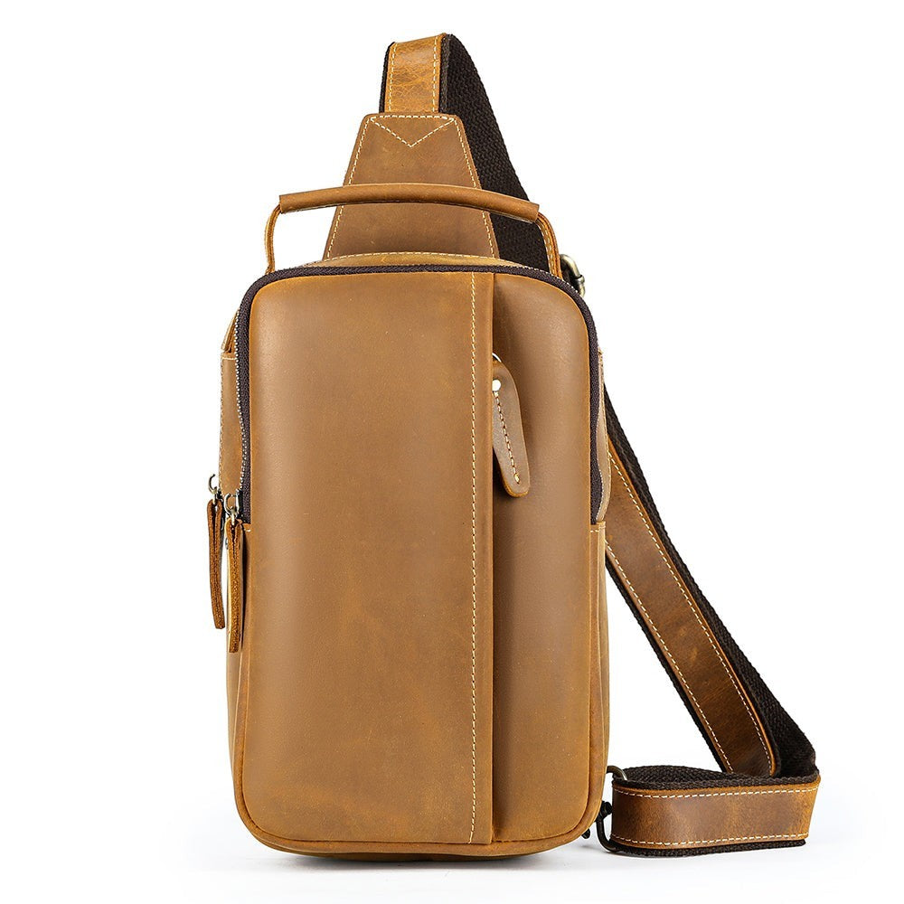 Barcon Getta Inc MERIDIAN brown genuine leather vertical cross-body bag with multiple zippered compartments and adjustable strap.