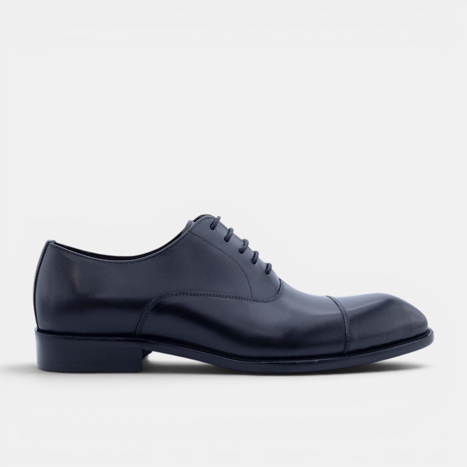 Barcon Getta Inc MOGADISHU CLASS navy full grain leather Oxford dress shoe with cap toe and closed lacing.