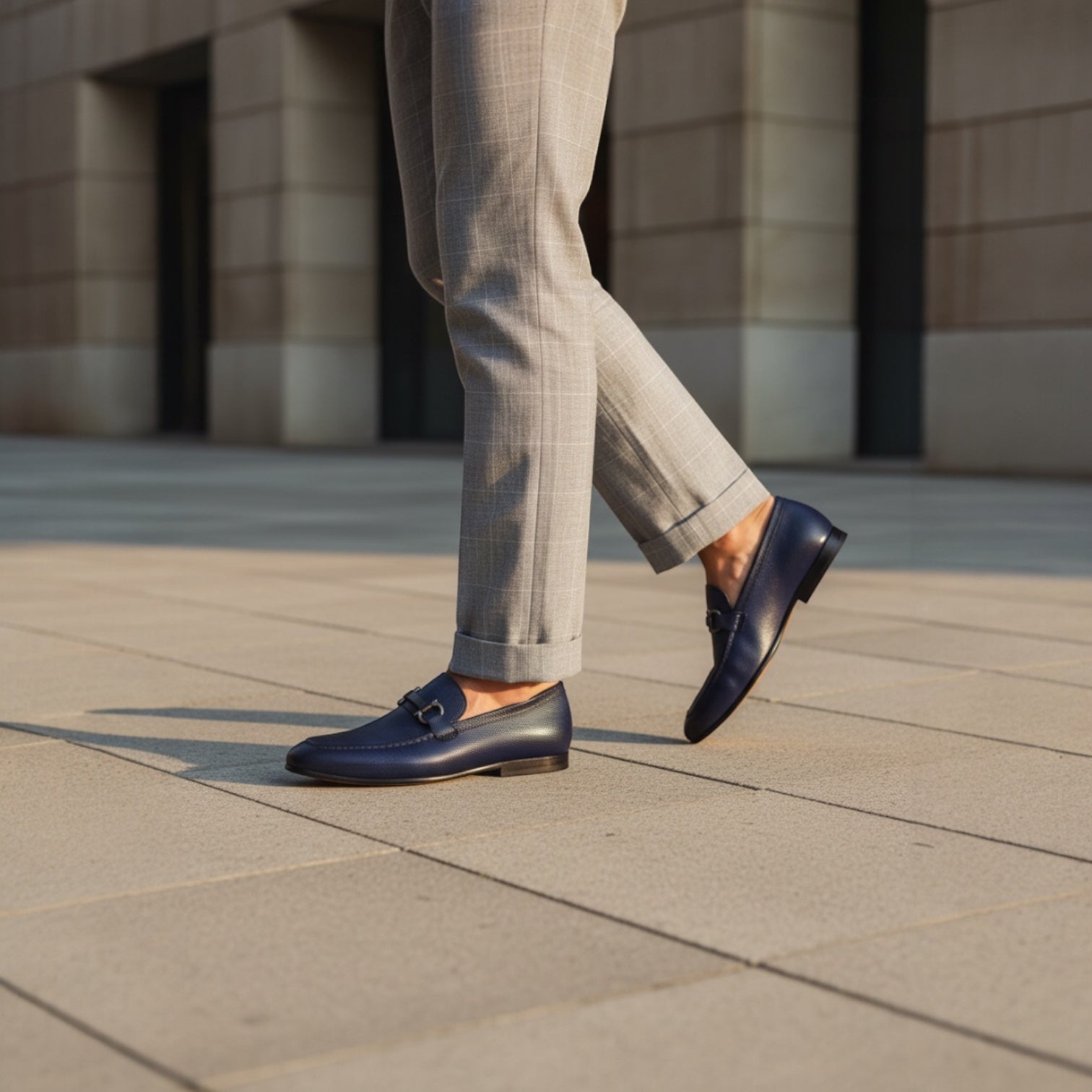 Barcon Getta Inc. NAMPULA navy blue textured leather horsebit loafers with gunmetal hardware.