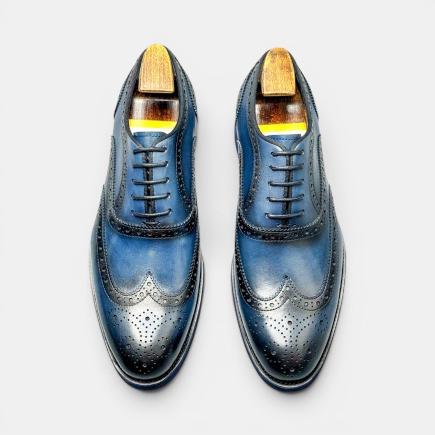 Barcon Getta Inc PORTO-NOVO deep navy blue full grain leather wingtip Oxford dress shoes with brogue detailing and rubber sole.