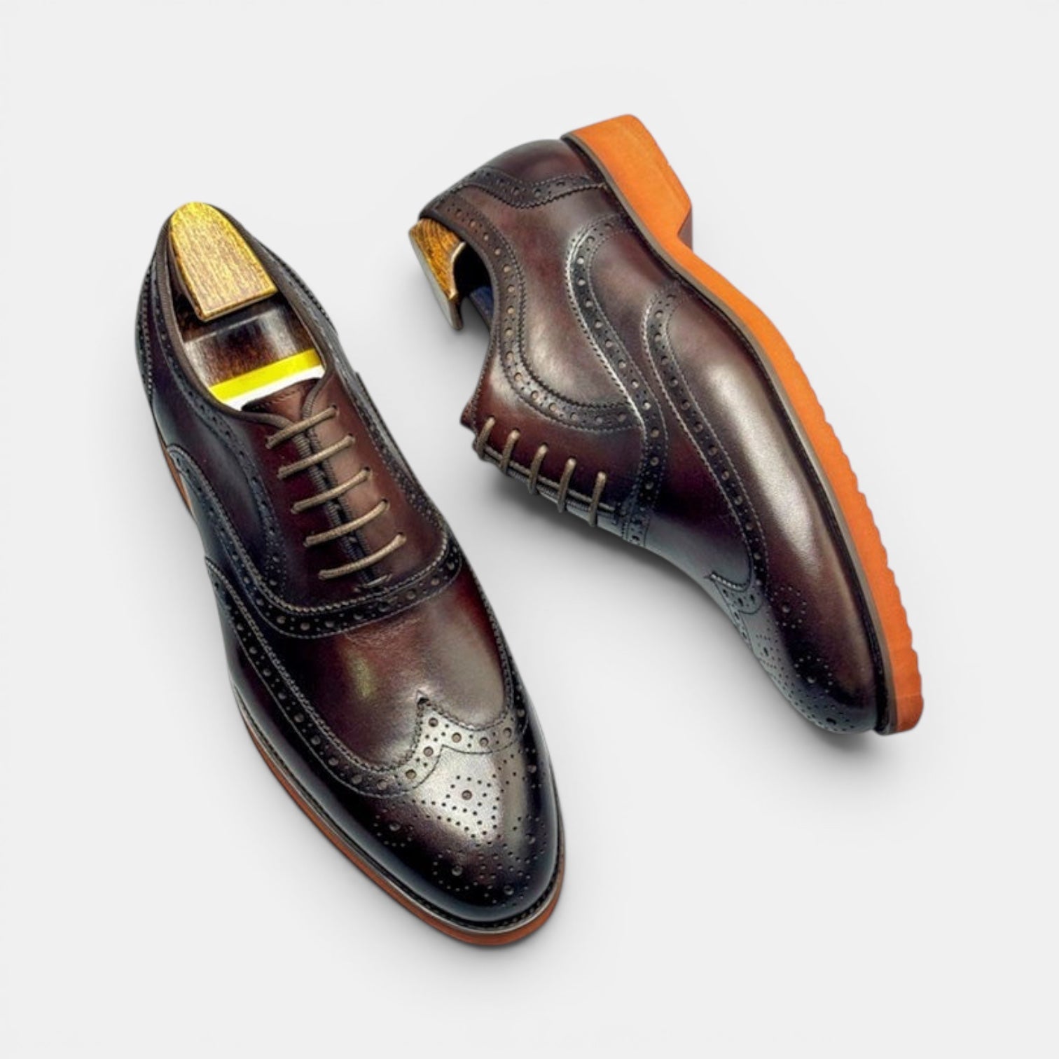 Barcon Getta Inc PORTO-NOVO oxblood dark brown full grain leather wingtip Oxford dress shoes with orange rubber sole.