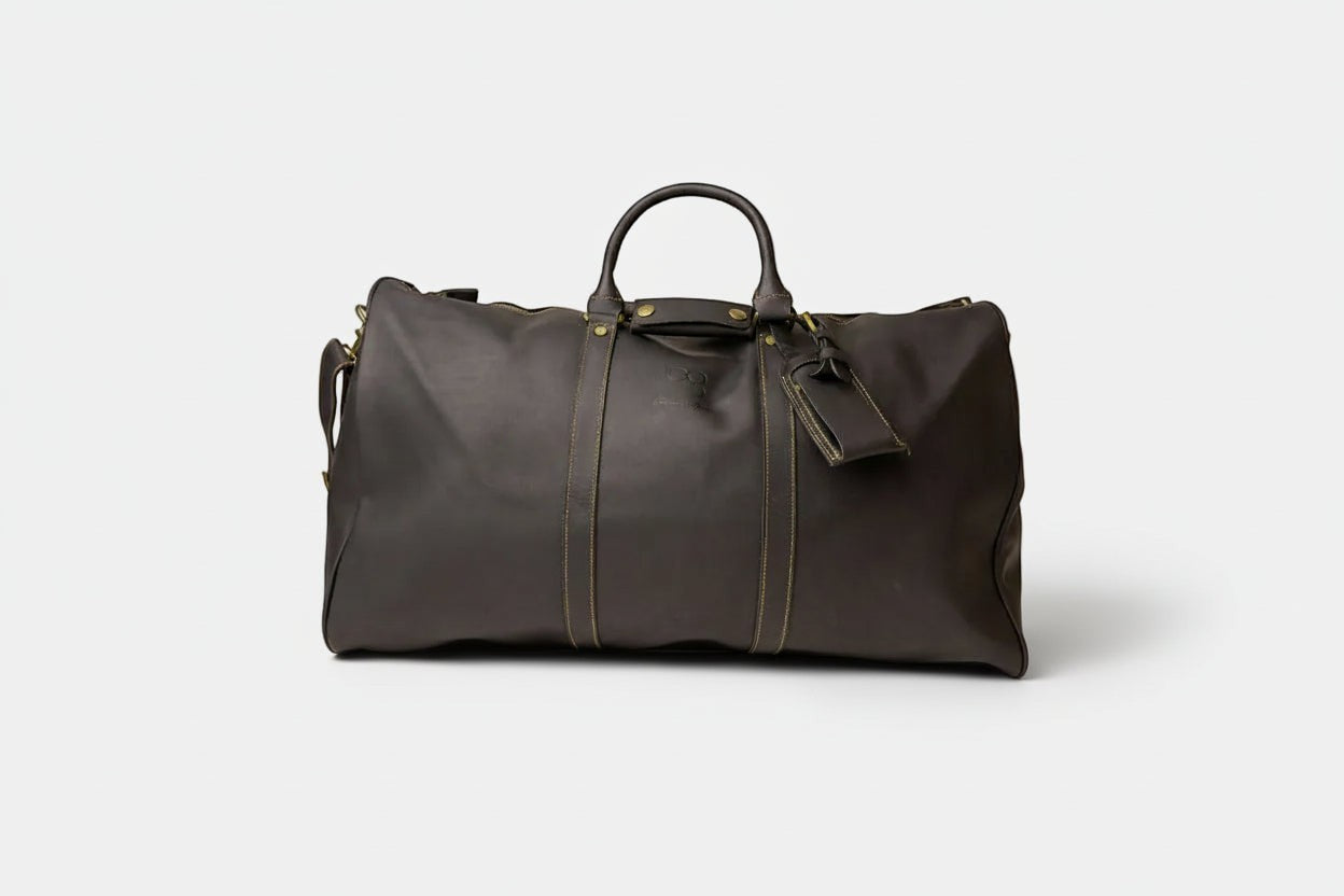 Barcon Getta Inc RASSI dark brown distressed leather duffel bag with top handles and shoulder strap.